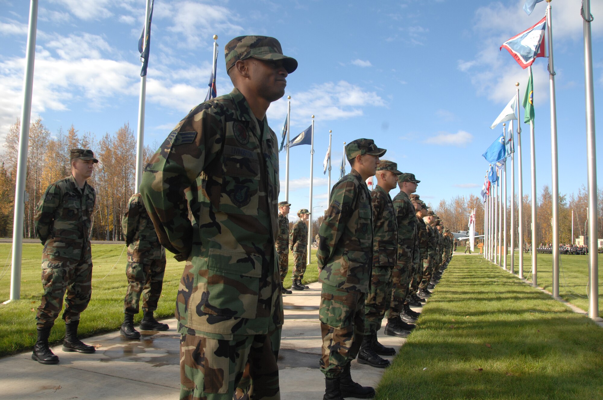 EIELSON AIR FORCE BASE, Alaska --  Airmen of the 354th Fighter Wing await the arrival of Brig. Gen. Mark Graper, 354th Fighter Wing commander, during the Prisoner of War and Missing in Action (POW/MIA) Recognition Day retreat ceremony at Heritage Park on September 21, 2007. The ceremony was a base-wide function honoring all POW/MIA. Observances of National POW/MIA Recognition Day are held across the country on military installations, ships at sea, state capitols, schools and veterans' facilities. This observance is one of six days throughout the year that Congress has mandated the flying of the National League of Families' POW/MIA flag. (U.S. Air Force photo by Airman 1st Class Christopher Griffin)  (U.S. Air Force photo by Airman 1st Class Christopher Griffin)