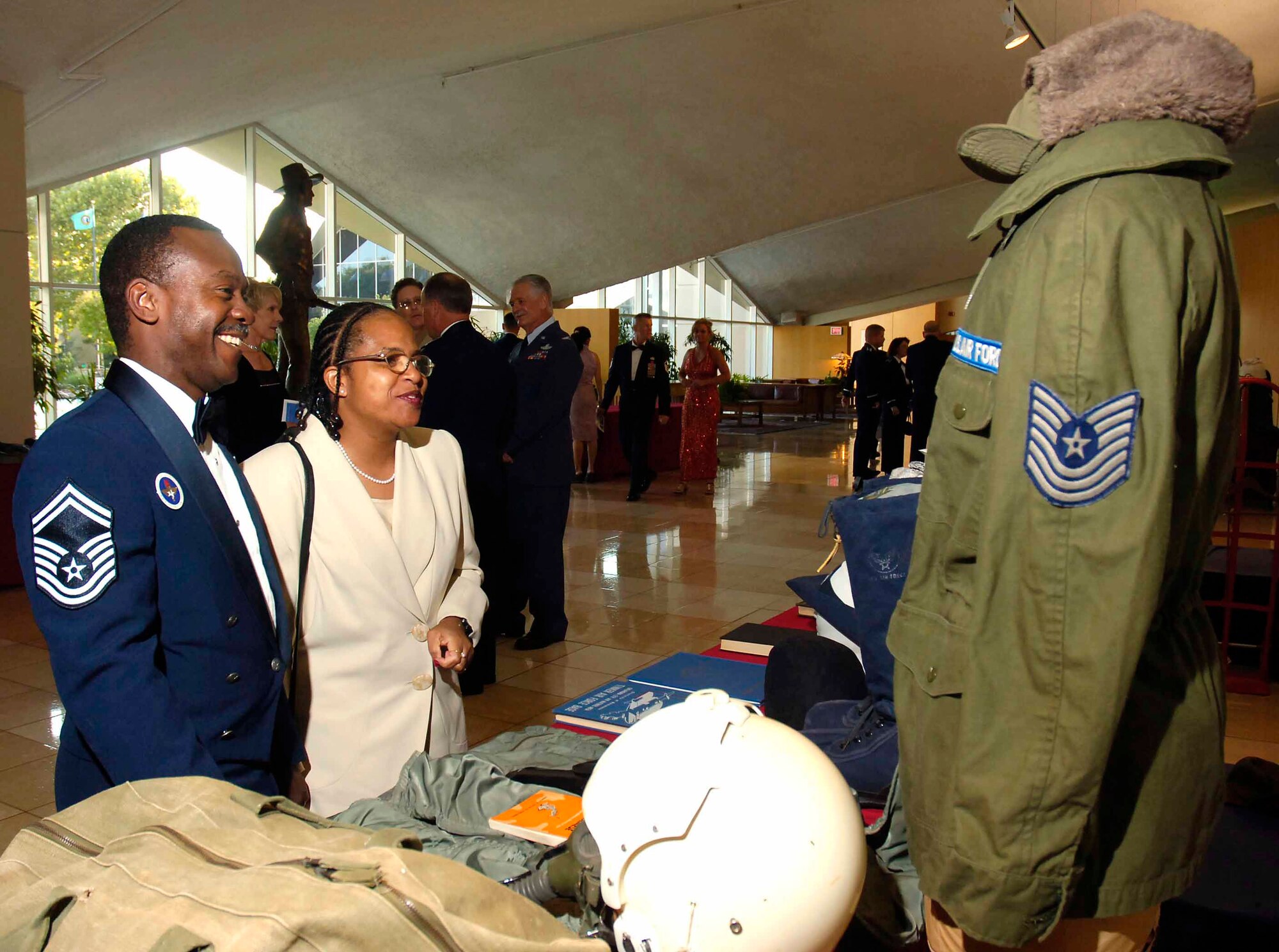 Senior Master Sgt. Leroy Lewis and his wife Tammy look at vintage military uniforms and equipment displayed at the Air Force Ball Sept. 14, held at the National Cowboy and Western Heritage Museum in Oklahoma City. Sergeant Lewis is with the 373rd Training Squadron, Detachment 9. (Air Force photo by Dave Faytinger)