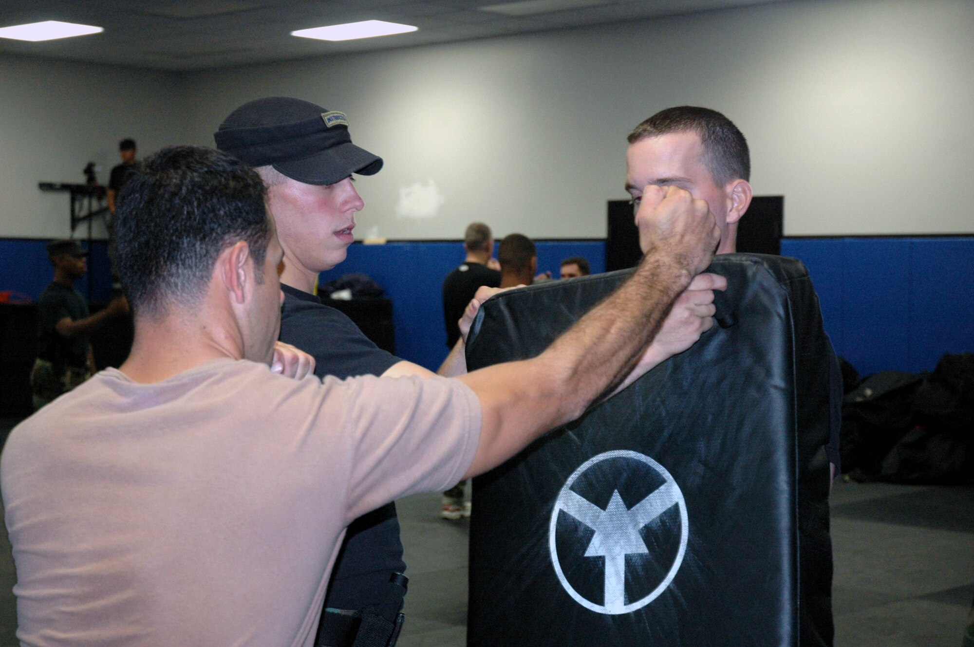 Phoenix Raven instructor Staff Sgt. James Chubb shows Raven students proper technique for a strike with an ASP baton Sept. 18, 2007, during baton and self defense training in the U.S. Air Force Expeditionary Center on Fort Dix, N.J.  The Phoenix Raven Training Course is taught by the Center's 421st Combat Training Squadron.  (U.S. Air Force Photo/Tech. Sgt. Scott T. Sturkol)