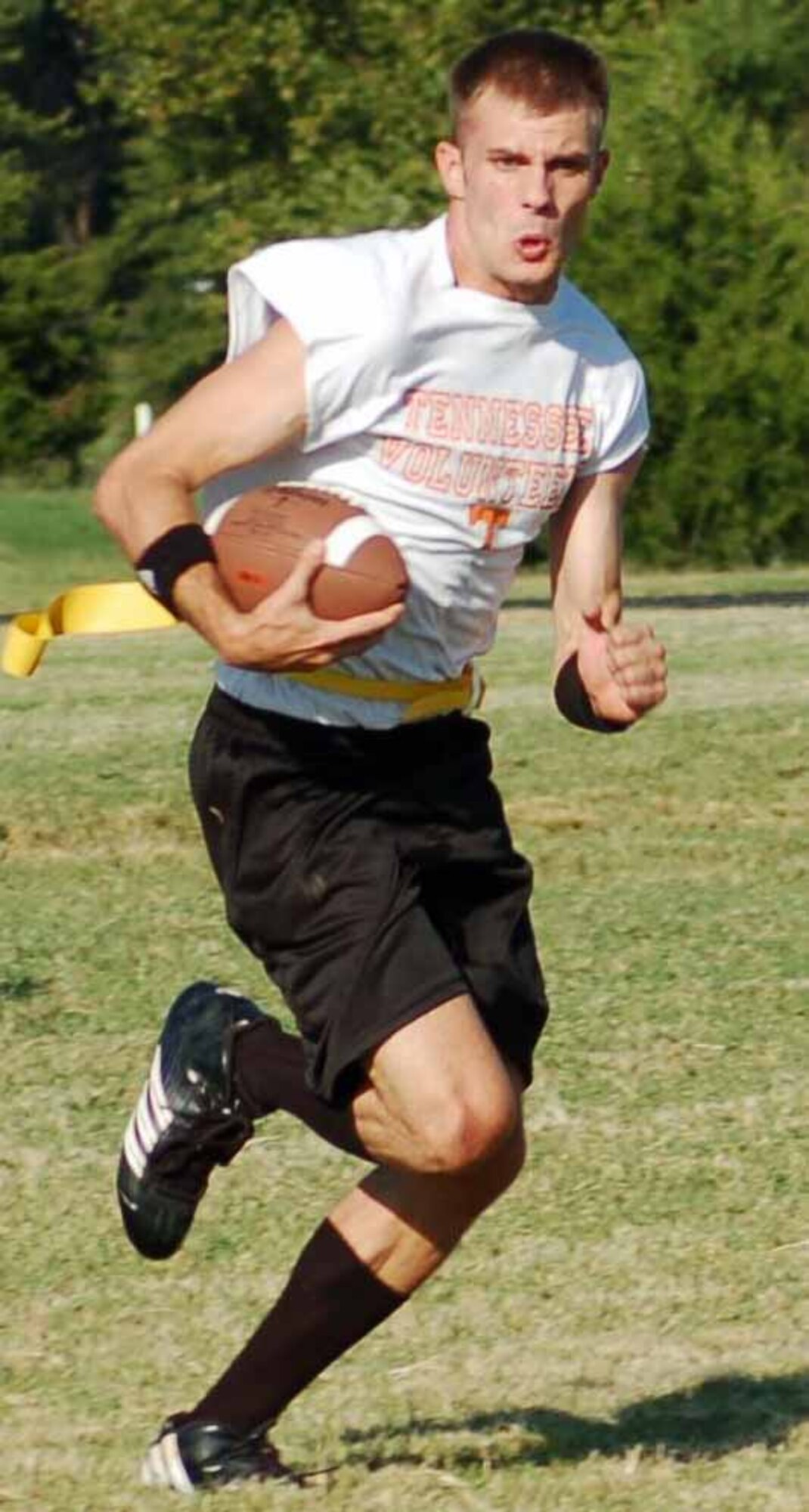 32nd Combat Communications Squadron quarterback Rob Massey darts upfield Sept. 12 in a game against the Marines at the Tinker Sports Complex. The 32nd CCS won the game 18-6. (Air Force photo by John E. Banks)