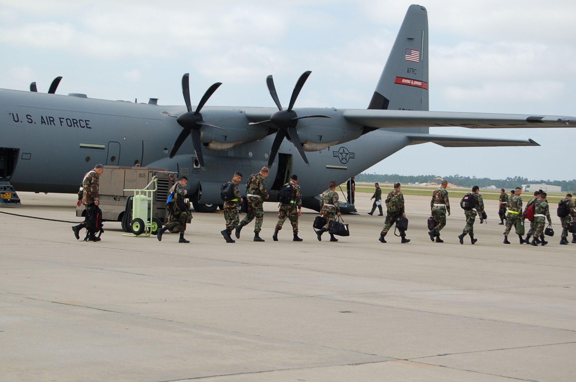 Reservists with the Alamo Wing board the C-130 to take them home after the Operational Readiness Excercise was called to a halt due to severe weather. The team managed to evacuate the area within 12 hours of the weather evacuation order. (U.S. Air Force Photo/Master Sgt. Collen McGee)