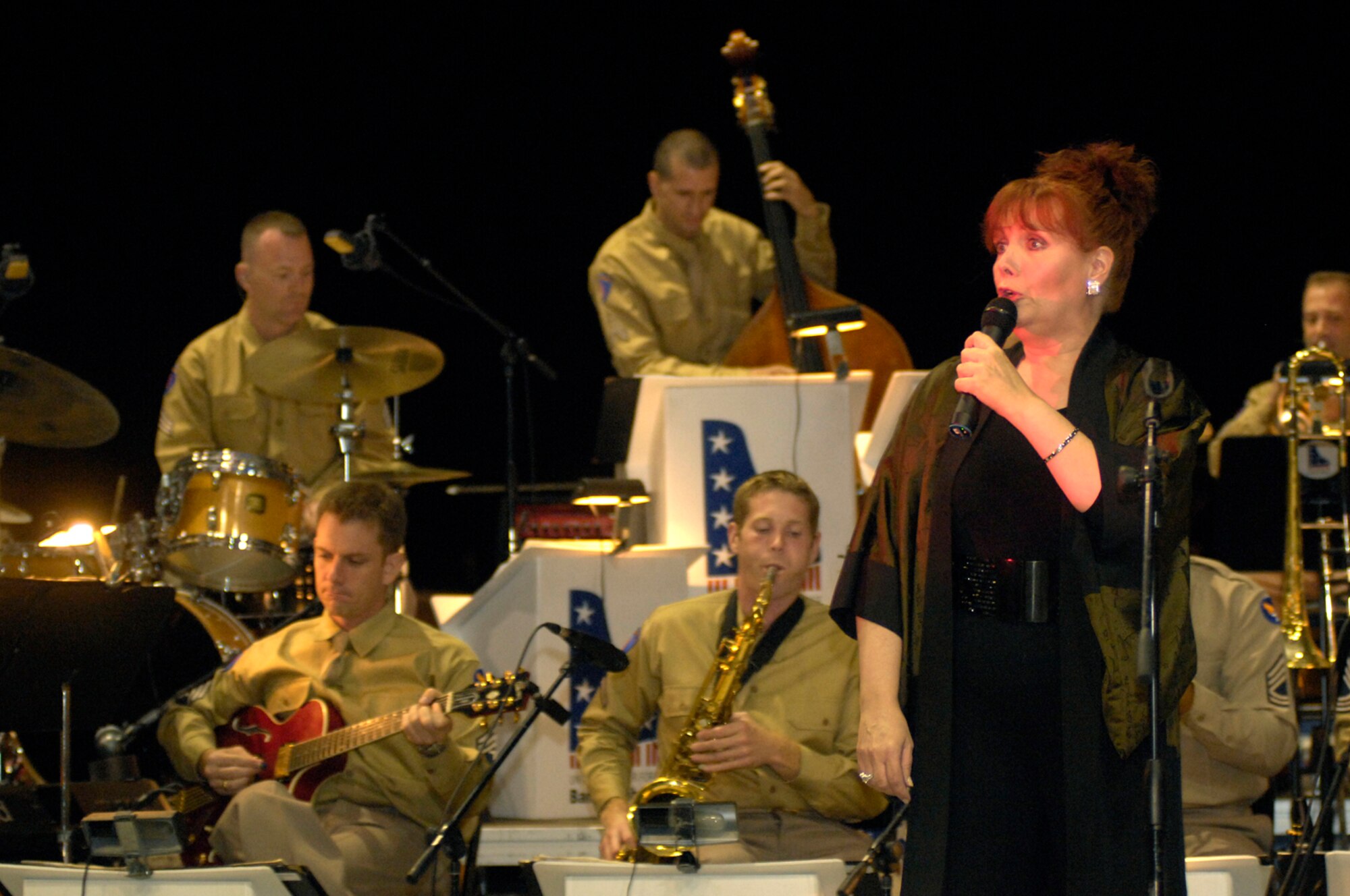 International recording artist Maureen McGovern performs with the Air Force Band of Liberty during the Air Force 60th Anniversary Ball. Ms. McGovern performed a moving rendition of “God Bless America” and her academy award winning song, “The Morning After,” from the movie, “Poseidon Adventure.” Ms. McGovern also performed with the Band of Liberty during the band’s Heritage to Horizons concert on Saturday. The event, which celebrated the 60th anniversary of the Air Force, was held in the Massachusetts Institute of Technology Kresge Auditorium  in Cambridge, Mass. (U.S. Air Force photo by Mark Wyatt.)