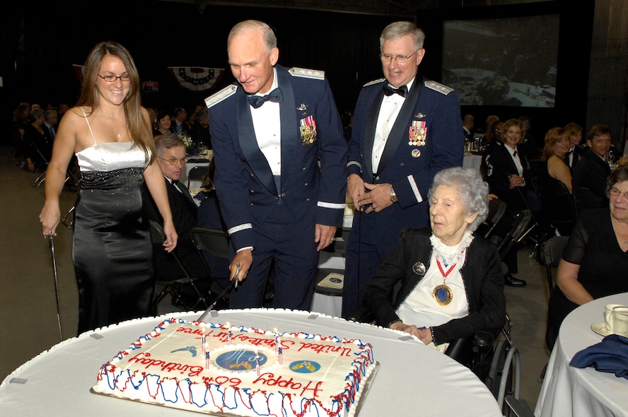 From left, Lee Wyatt Salisbury, Electronic Systems Center Commander Lt. Gen. Chuck Johnson,  Air Force Deputy Chief of Staff for Personnel Lt. Gen. Roger Brady, and retired Chief Master Sergeant Esther MacKay take turns cutting the Air Force Birthday cake during the Air Force Ball Sept. 14. Miss Salisbury joined the Air Force during the ball; her Oath of Enlistment was administered by General Johnson. Chief MacKay, 102, is the oldest living retired Chief Master Sergeant. General Brady was the keynote speaker during the evening. (U.S. Air Force photo by Mark Wyatt.)