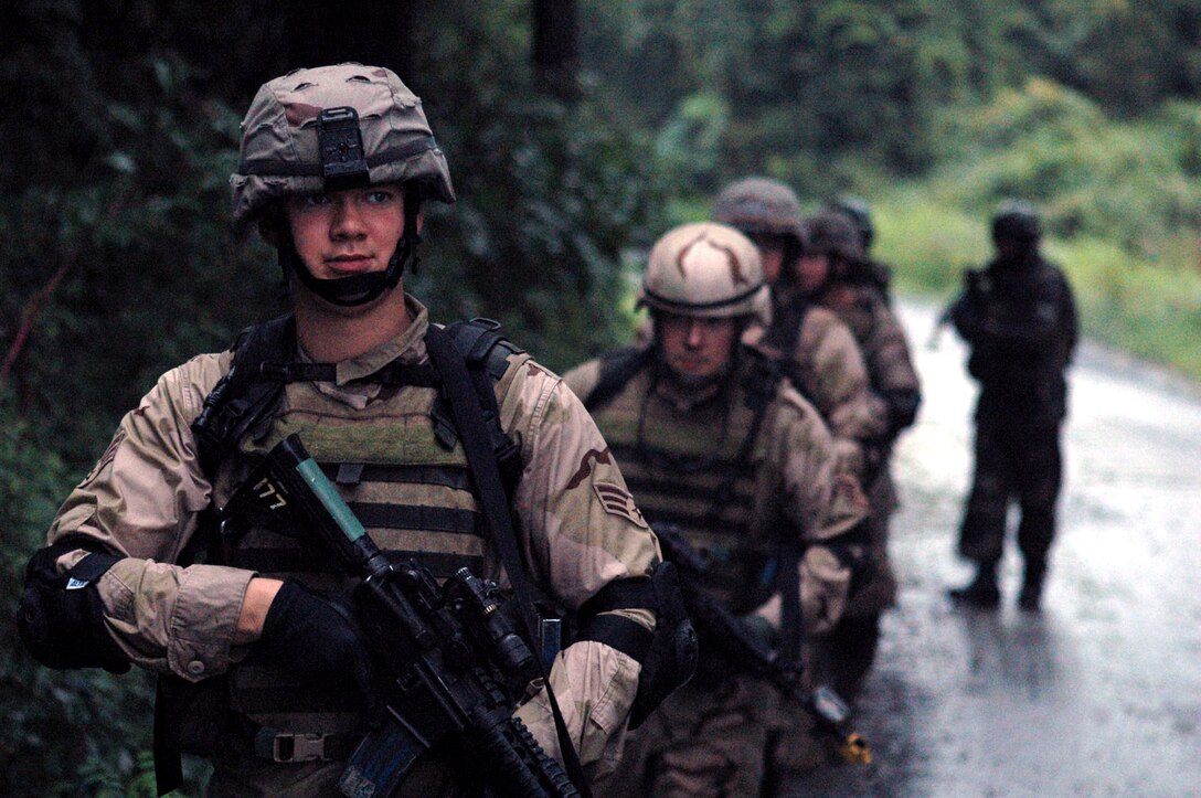 Students in the Air Force Phoenix Warrior Training Course 07-6 conduct a dismounted patrol during training Aug. 21 on a range at Fort Dix, N.J.  The course is taught by the U.S. Air Force Expeditionary Center's 421st Combat Training Squadron where Air Force security forces Airmen practice expeditionary combat skills. (U.S. Air Force photo/Tech. Sgt. Scott T. Sturkol)