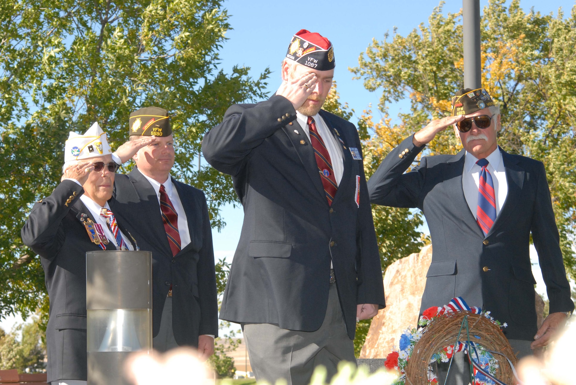 Local veterans, left to right, Sam Pappas, Eric Peterson, Will Smith and Frank Tuss, render a salute at the wreath placed during Malmstrom Air Force Base's POW/MIA Remembrance Ceremony Spet. 21. (U.S. Air Force photo/John Turner)