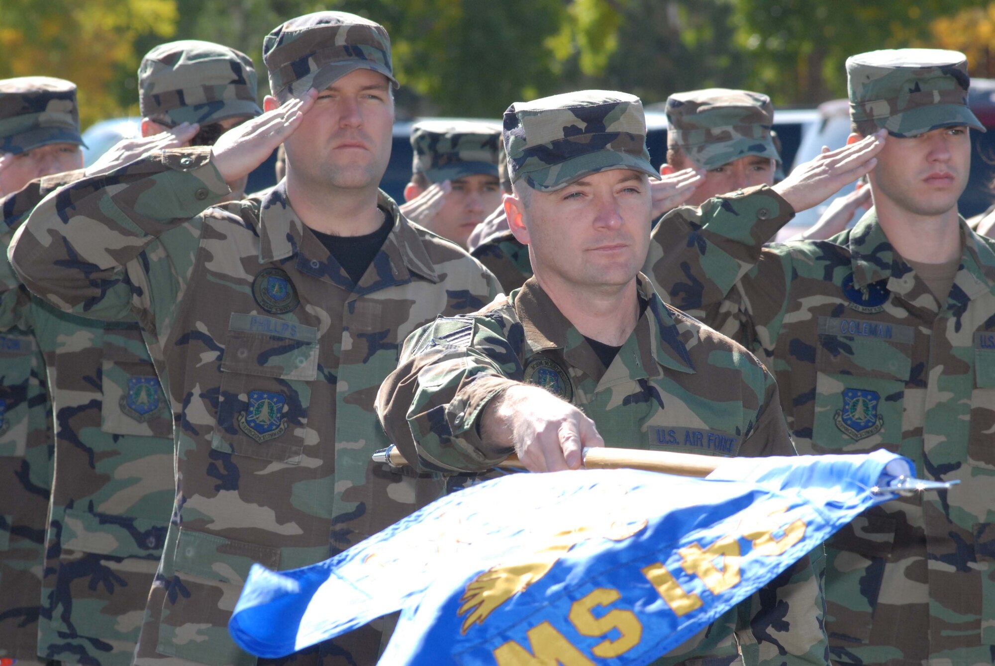 Members of the 341st Maintenance Group formation salute during the playing of the National Anthem at the start of the POW/MIA Remembrance Ceremony Sept. 21. Team Malmstrom honored past prisoners of war and those still missing in action at the retreat ceremony at Medal of Honor Park. (U.S. Air Force photo/John Turner)