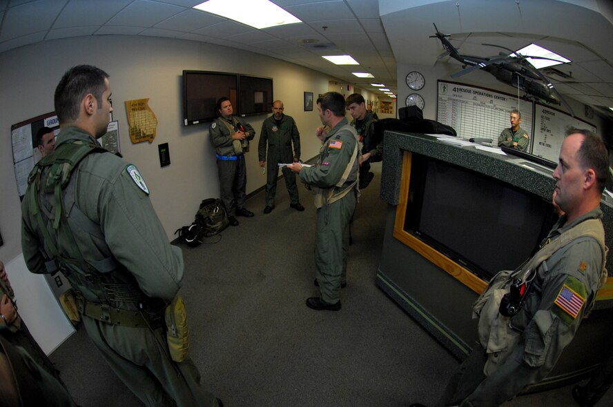Capt. Paul Sheets, 41st Rescue Squadron HH-60G Pave Hawk pilot , briefs aircrews during a real-world rescue mission Sept. 20. Three Moody aircraft supported the mission in the Gulf of Mexico, rescuing one individual. (U.S. Air
Force photo by Senior Airman Angelita M Lawrence) 