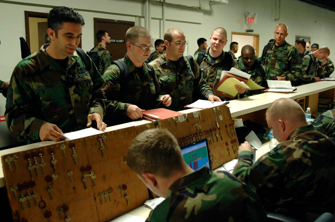 U.S. Air Force Airmen from the 7th Bomb Wing, Dyess Air Force Base (AFB), Texas, in-process and receive keys to their rooms at Ellsworth AFB, S.D., Sept. 20, 2007. Ellsworth will temporarily house an additional 550 Airmen and 20 B-1 aircraft during the repair of 6,600 feet of runway at Dyess. (U.S. Air Force photo by SSgt Michael B. Keller)
