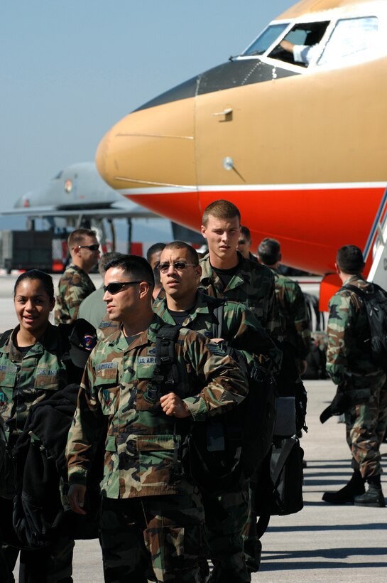 U.S. Air Force Airmen from the 7th Bomb Wing, Dyess Air Force Base (AFB), Texas, exit an aircraft on the flightline at Ellsworth AFB, S.D., Sept. 20, 2007. Ellsworth will temporarily house an additional 550 Airmen and 20 B-1 aircraft during the repair of 6,600 feet of runway at Dyess. (U.S. Air Force photo by SSgt Michael B. Keller)