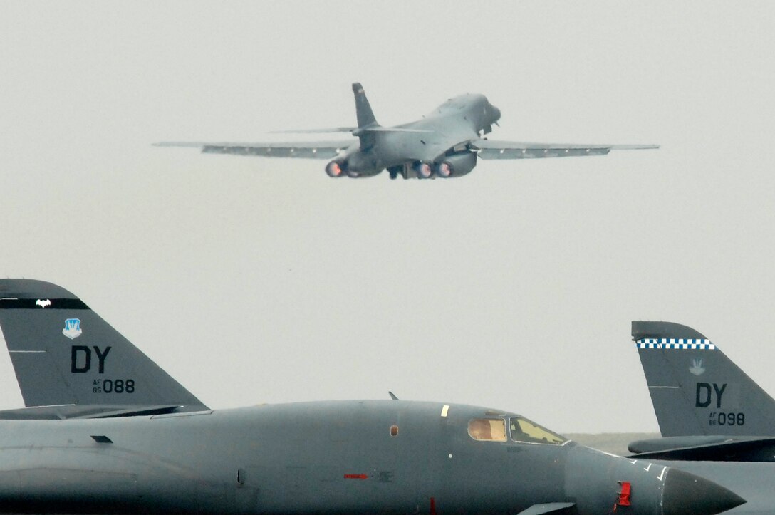 A B-1B Lancer takes off at Ellsworth Air Force Base (AFB), S.D., over B-1s from Dyess AFB, Texas, Sept. 17, 2007. Ellsworth will temporarily house an additional 550 Airmen and 20 B-1 aircraft during the repair of 6,600 feet of runway at Dyess. (U.S. Air Force photo by SSgt Michael B. Keller)