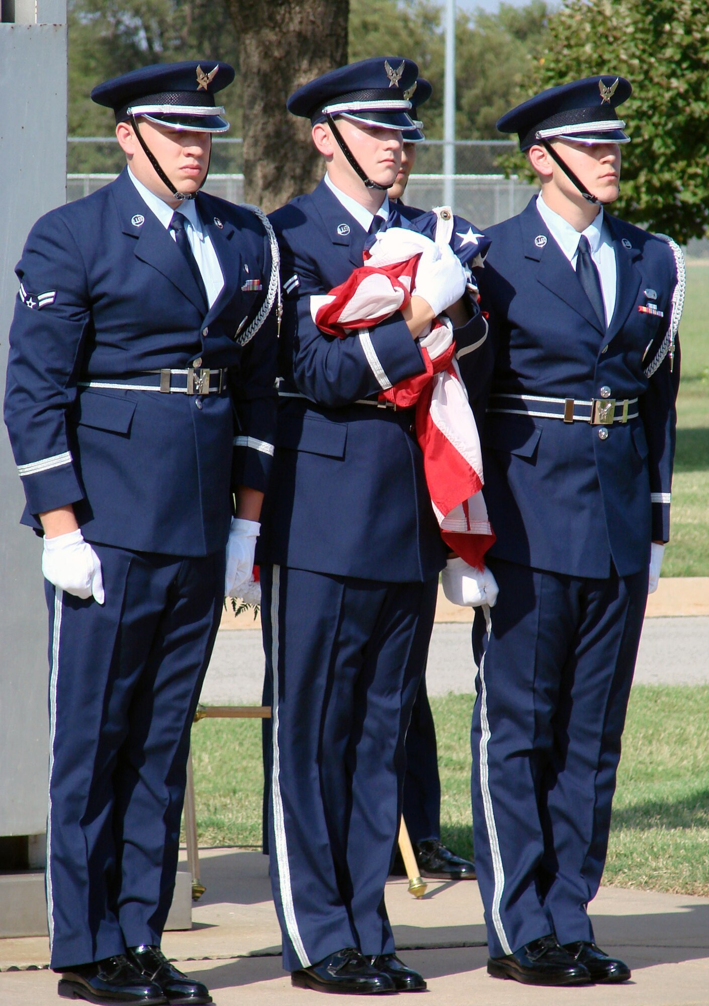 Members of the Vance Silver Talons Honor Guard secure the flag at the conclusion of the Vance 2007 POW/MIA retreat ceremony Friday.  More than 100 base members and guests attended the event, including Fran Hoad, an Enid resident and World War II prisoner of war.  Mr. Hoad spent 13 months in a German prison camp after his B-17 aircraft was shot down by 105mm guns over Belgium April 10, 1944.  At the conclusion of the ceremony, Colonel Klumpp and Mr. Hoad laid a wreath at the base of the flagpole in front of the Vance headquarters building. A group of T-38s from the 25th Flying Training Squadron flew over the gathering in a “missing man” formation to symbolize fallen comrades. POW/MIA Recognition Day was established in 1979 to honor prisoners of war who returned home, as well as those still missing in action. (U.S. Air Force photo by Capt. Tony Wickman)