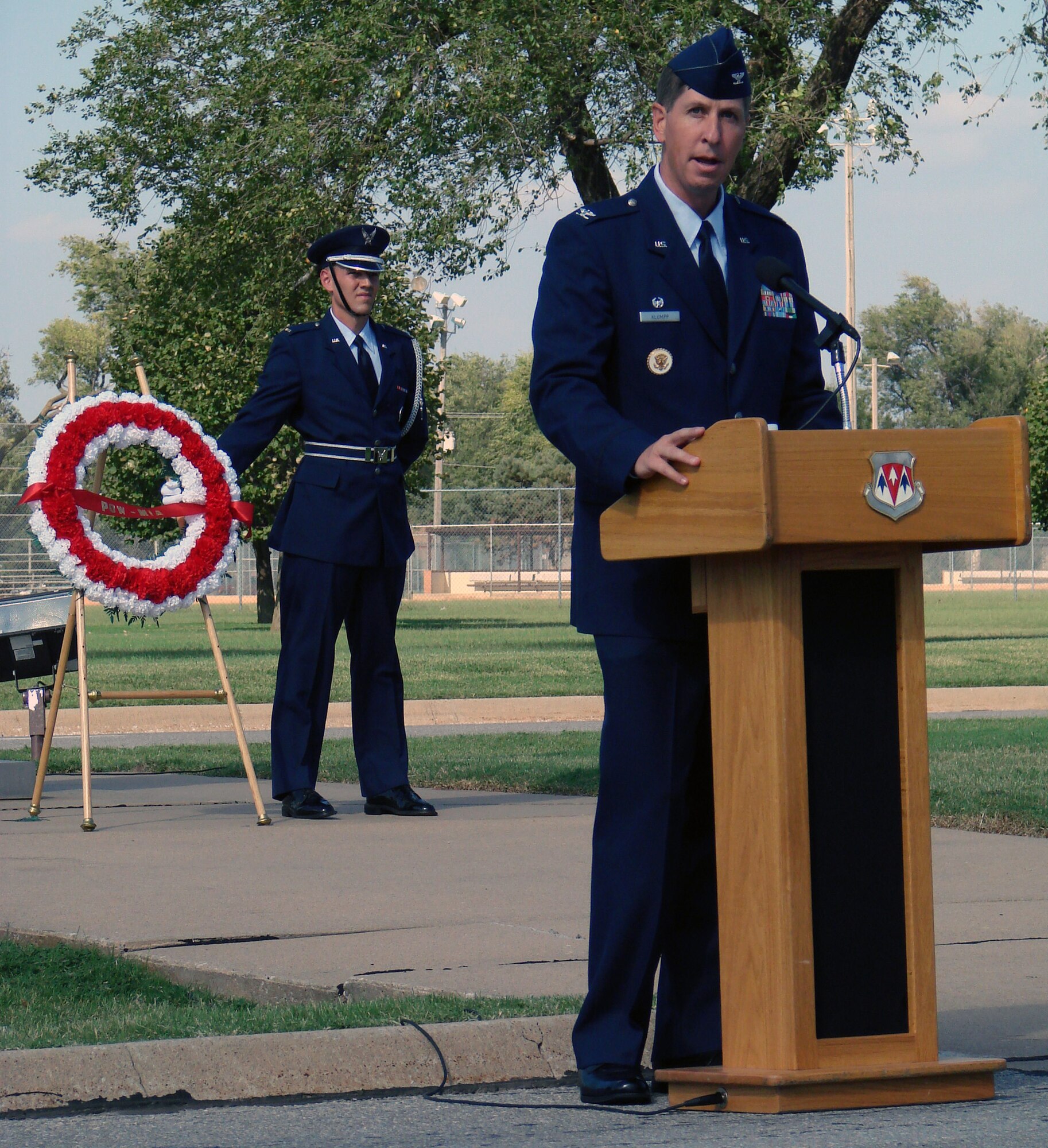 Col. Richard Klumpp, Jr., 71st Flying Training Wing commander, spoke to more than 100 base members and guests at the Vance 2007 POW/MIA retreat ceremony Friday.  The guest of honor was Fran Hoad, a World War II prisoner of war who spent 13 months in a German prison camp after his B-17 aircraft was shot down by 105mm guns over Belgium April 10, 1944. In his speech, Colonel Klumpp said, “We salute the quiet courage of families who have waited, in some cases for decades, for word of a loved one’s fate. Our solemn pledge to these families is that we will never forget their loved one’s sacrifices, and we will never cease our efforts to locate them and return them home.” At the conclusion of the ceremony, Colonel Klumpp and Mr. Hoad laid a wreath at the base of the flagpole in front of the Vance headquarters building. A group of T-38s from the 25th Flying Training Squadron flew over the gathering in a “missing man” formation to symbolize fallen comrades. POW/MIA Recognition Day was established in 1979 to honor prisoners of war who returned home, as well as those still missing in action.(U.S. Air Force photo by Capt. Tony Wickman)