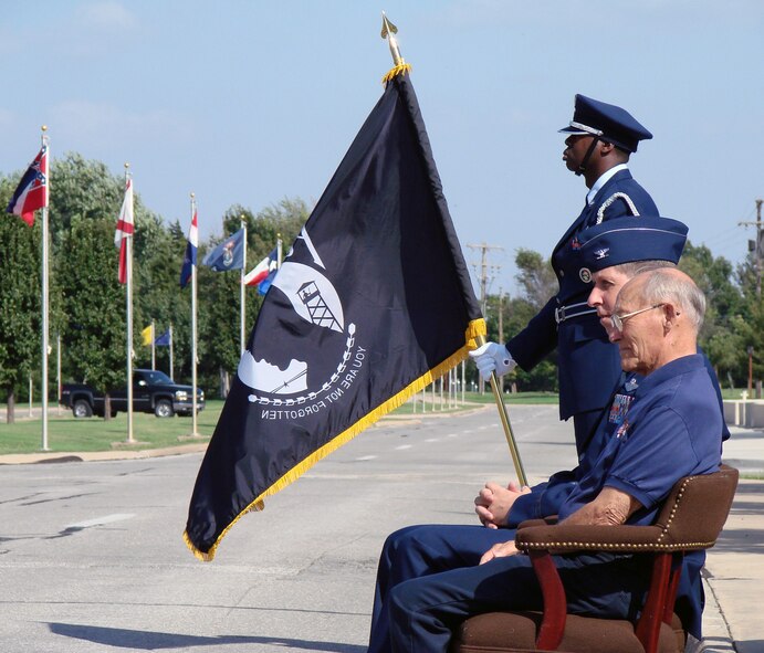 Fran Hoad, an Enid resident and World War II prisoner of war, and Col. Richard Klumpp, Jr., 71st Flying Training Wing commander, listen to introductions Friday at the Vance 2007 POW/MIA retreat ceremony.  Mr. Hoad spent 13 months in a German prison camp after his B-17 aircraft was shot down by 105mm guns over Belgium April 10, 1944. At the conclusion of the ceremony, Colonel Klumpp and Mr. Hoad laid a wreath at the base of the flagpole in front of the Vance headquarters building. A group of T-38s from the 25th Flying Training Squadron flew over the gathering in a “missing man” formation to symbolize fallen comrades. POW/MIA Recognition Day was established in 1979 to honor prisoners of war who returned home, as well as those still missing in action.(U.S. Air Force photo by Capt. Tony Wickman)