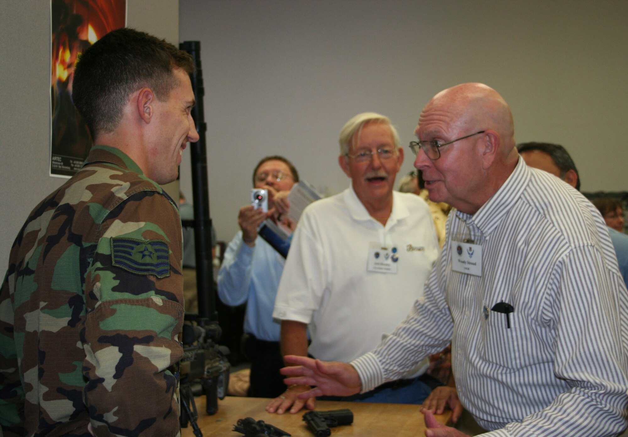 PATRICK AFB, Fla. - Tech. Sgt. Wahlstedt informs a Civic Leader group from Wright-Patterson AFB, Ohio about the weapons used by pararescuemen from the 308th Rescue Squadron.  The 445th Airlift Wing and the 88th Air Base Wing hosted the civic leaders on a C-5 Galaxy flight to Patrick AFB, Fla. to enhance community awareness of the total force mission. (U.S. Air Force photo/Laura Darden)  
