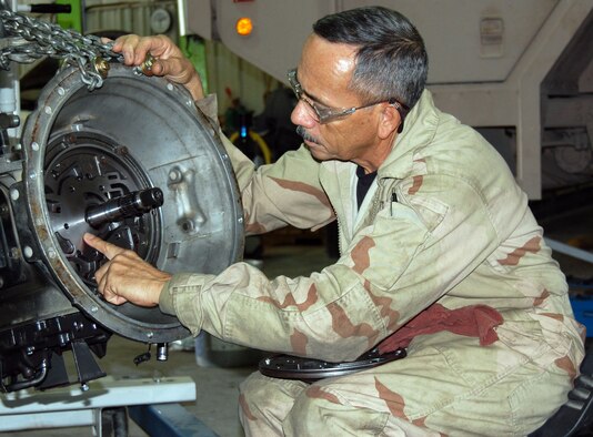 Tech. Sgt Nefatali Vallelopez, 386th Expeditionary Logistics Readiness, vehicle maintenance technician, inspects a transmission pump for defects Sept. 24 in the transportation garage. The garage is where broken vehicle are sent for repairs. (Photo by Staff Sgt. Phillip Butterfield)