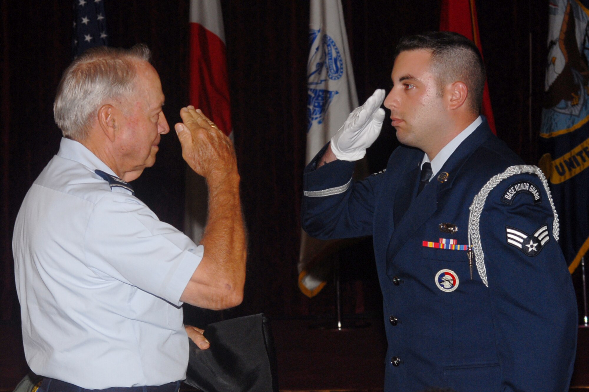 Retired Air Force Col. James L. Lamar is given a POW/MIA flag by the Kadena honor gurard after his speech during the ceremony at the Rocker NCO club on Sept. 21, Kadena AB, Japan.  (U.S. Air Force photo/Senior Airman Darnell Cannady)

