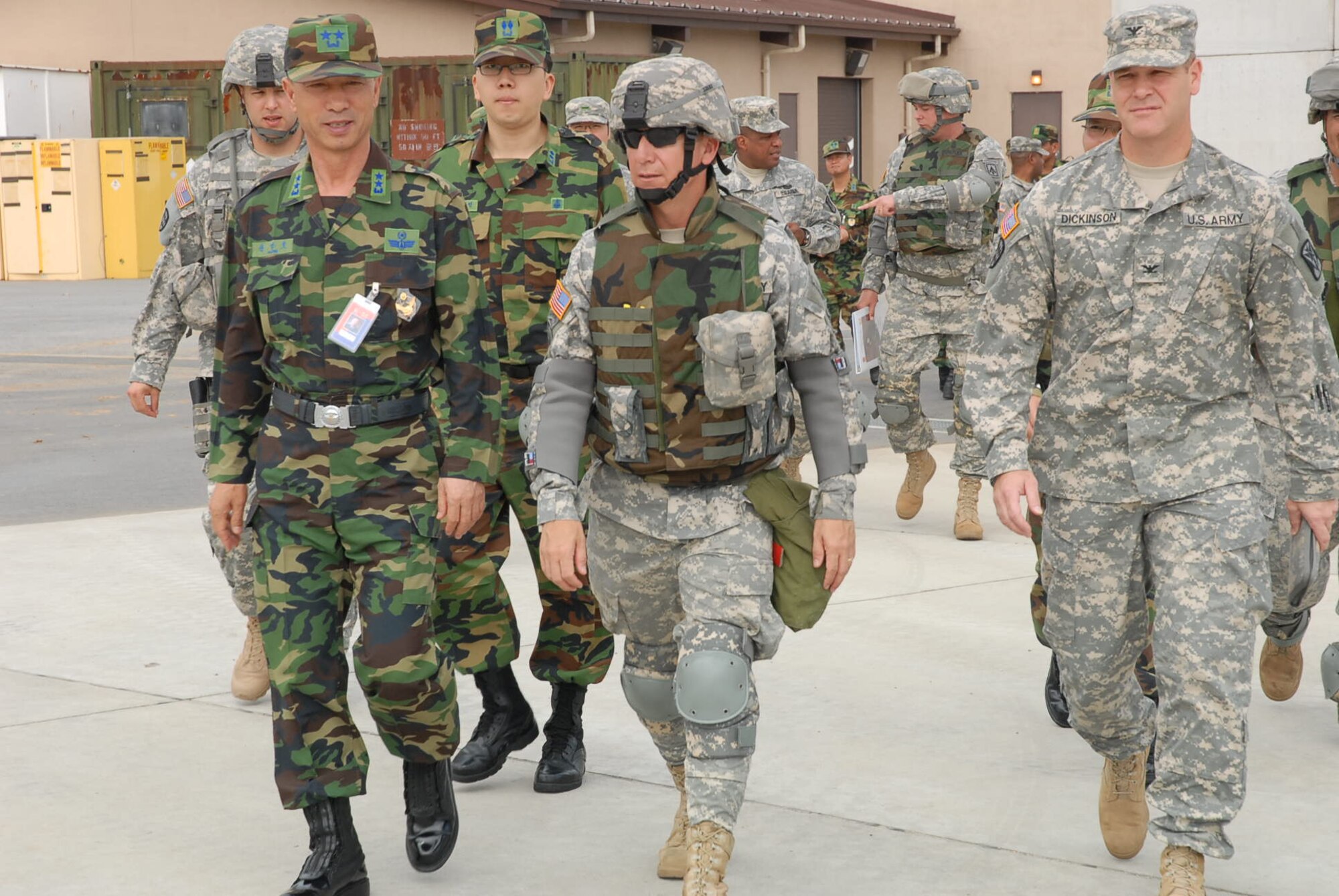 OSAN AIR BASE, Republic of Korea --  Maj. Gen. Kwon, Young-Huo, Republic of Korea Air Defense Artillery Commander (left), strolls the 1st Battalion, 7th Air Defense Artillery, site with Col. James H. Dickinson (right), 35th ADA BDE commander, and Lt. Col. Eric L. Sanchez, 1-7 ADA commander (middle), to check on the brigade’s air defense artillery equipment Sept. 20.  As part of the ROK ADA’s decision to purchase missiles like those used by the 35th ADA BDE, the visit helped the ROK ADA unit get a better look at the equipment and see how the equipment aids in the mission of providing air defense artillery support for the Republic of Korea. (U.S. Army photo by Pfc. Gretchen Goodrich)