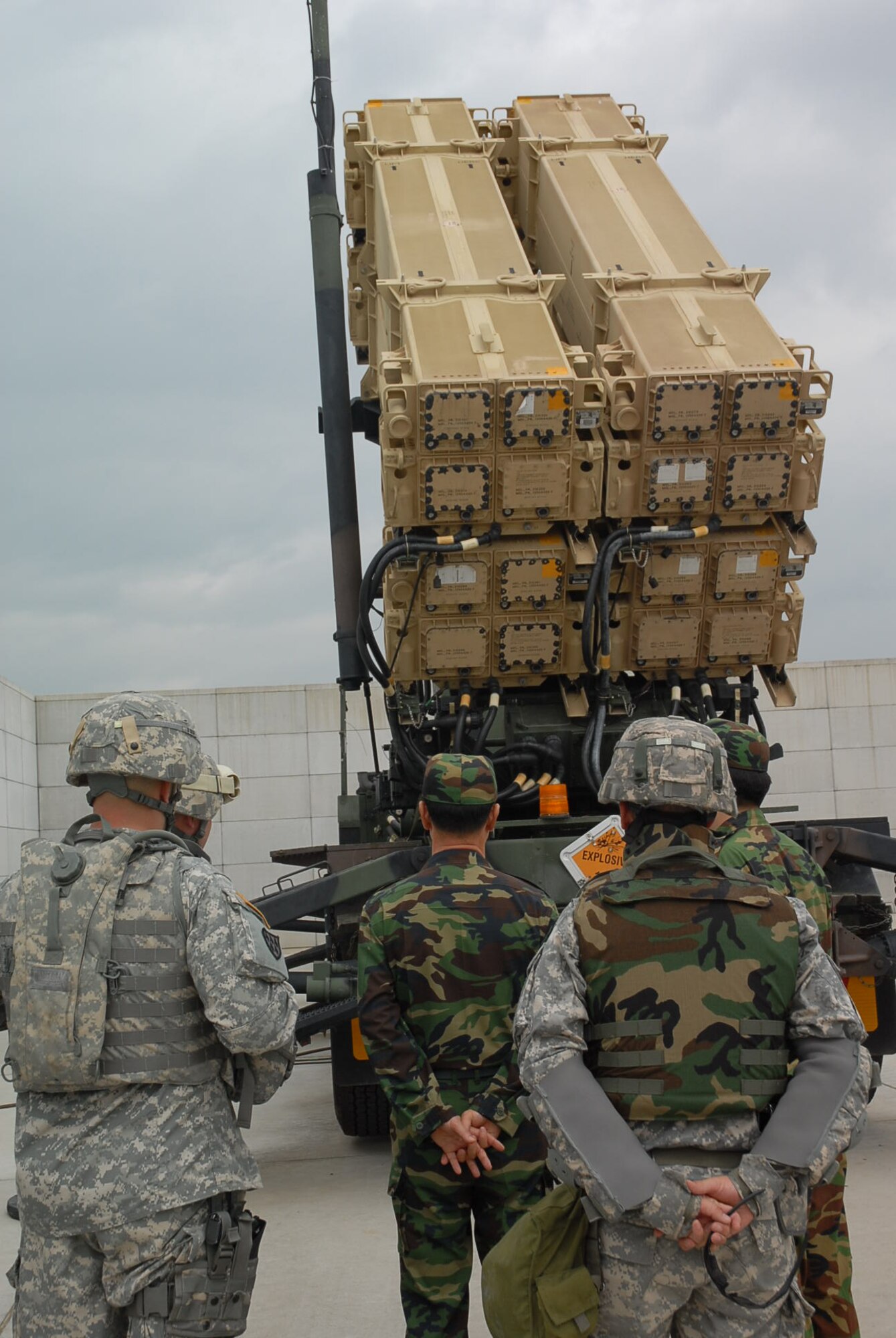 OSAN AIR BASE, Republic of Korea --  Maj. Gen. Kwon, Young-Huo, Republic of Korea Air Defense Artillery Commander, Lt. Col. Eric L. Sanchez, 1-7ADA commander, and Command Sgt. Maj. David M. Stonerock, 1-7 ADA CSM, observe one of the battalion’s PATRIOT missile launchers during Kwon’s visit Sept. 20 to the various 35th ADA BDE locations around the air base to confirm the decision to purchase new ADA equipment. (U.S. Army photo by Pfc. Gretchen Goodrich)