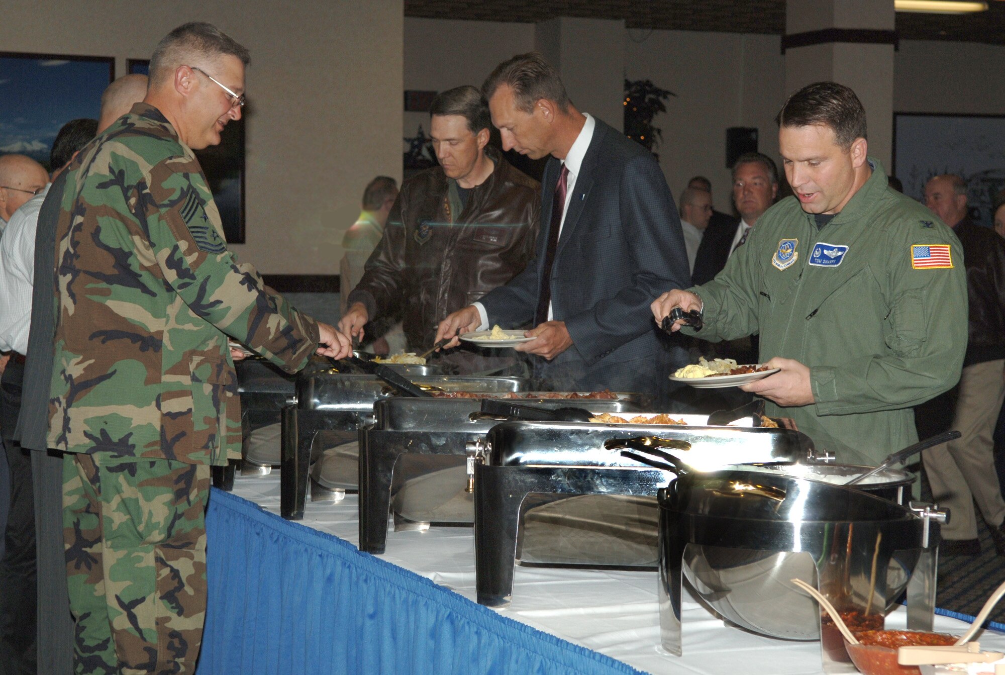 FAIRCHILD AIR FORCE BASE, Wash. – Fifty military and civilian leaders attended a breakfast meeting of the Greater Spokane Incorporated Armed Services Committee at Club Fairchild Sept. 25. Among those attending were, from left, Chief Master Sgt. Paul Sikora, 92nd Air Refueling Wing command chief; Col. Gregory Bulkley, 141st ARW commander; Jeff Severs, Greater Spokane Incorporated chief operating officer; and Col. Thomas Sharpy, 92nd ARW commander. The committee engages business and community leaders in supporting the armed services in the local region. (U.S. Air Force photo/Airman 1st Class Jocelyn Ford)
