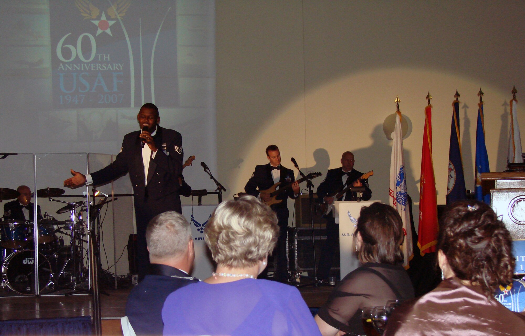 A member of Starlifter, a combo from the Air Force Band of the Midwest at Scott Air Force Base, Ill., serenades guests attending the Air Force 60th birthday celebration Saturday night at Cherokee Strip Conference Center. More than 390 attendees were treated to rousing tributes to the Air Force and Oklahoma, dining and dancing and a guest speech by Maj. Gen Irv Halter, 19th Air Force commander. Top officials from the base, the State of Oklahoma and the City of Enid attended the gala in downtown Enid to commemorate 60 year of an independent Air Force, 66 years of history at Vance and 100 years of heritage of the State of Oklahoma.  (Air Force photo by Capt. Tony Wickman)