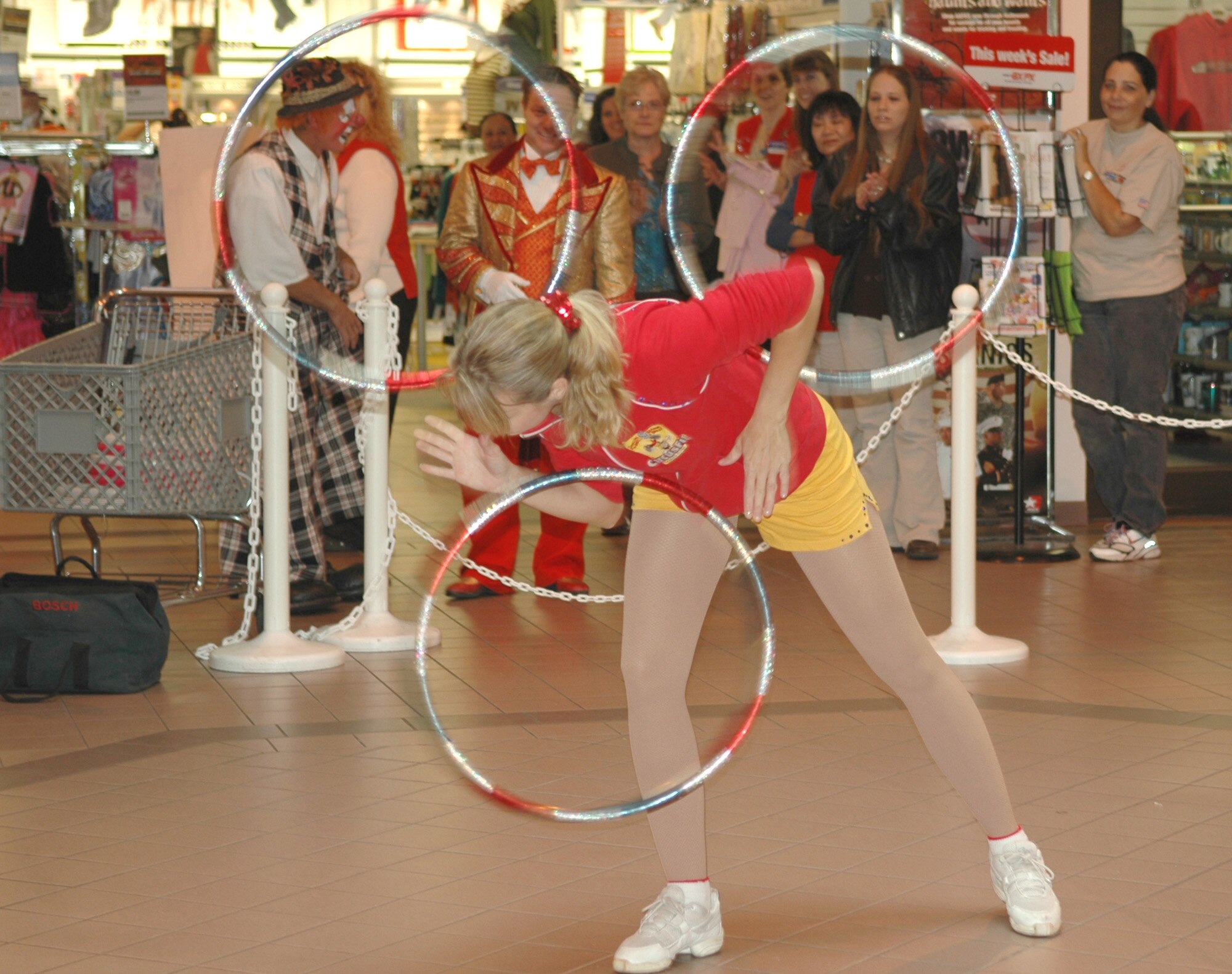 FAIRCHILD AIR FORCE BASE, Wash. – Victoria Zsilak, a performing juggler from Hungary with the Ringling Brothers and Barnum and Bailey circus, slides hula-hoops down her back at a brief performance for members of Team Fairchild in the Fairchild Exchange Sept. 20. (U.S. Air Force photo / Airman 1st Class Kali L. Gradishar)
