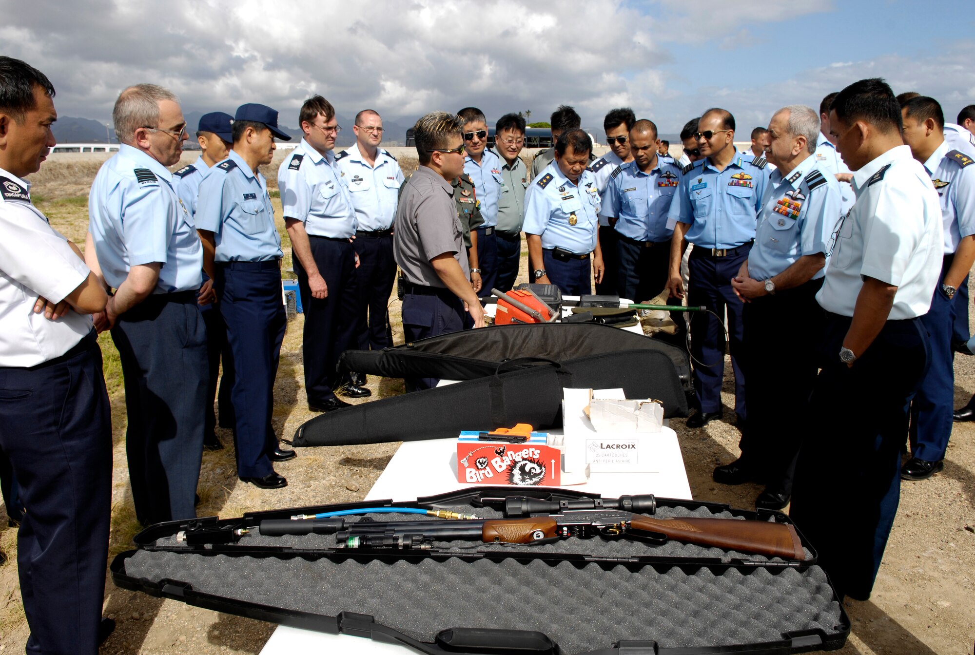 0Darrin Phelps discusses bird air strike hazard procedures with members of the Pacific Rim Airpower Symposium Sept. 20 at Hickam Air Force Base, Hawaii. The PACRIM Airpower Symposium provides an opportunity for U. S. Pacific Forces Command members to interface with many of the nations they work with in peacetime and crises. Mr. Phelps is the assistant district supervisor for the Hawaii U.S. Depart of Agriculture, Wild Life Services (U.S. Air Force photo/Tech. Sgt. Shane A. Cuomo)