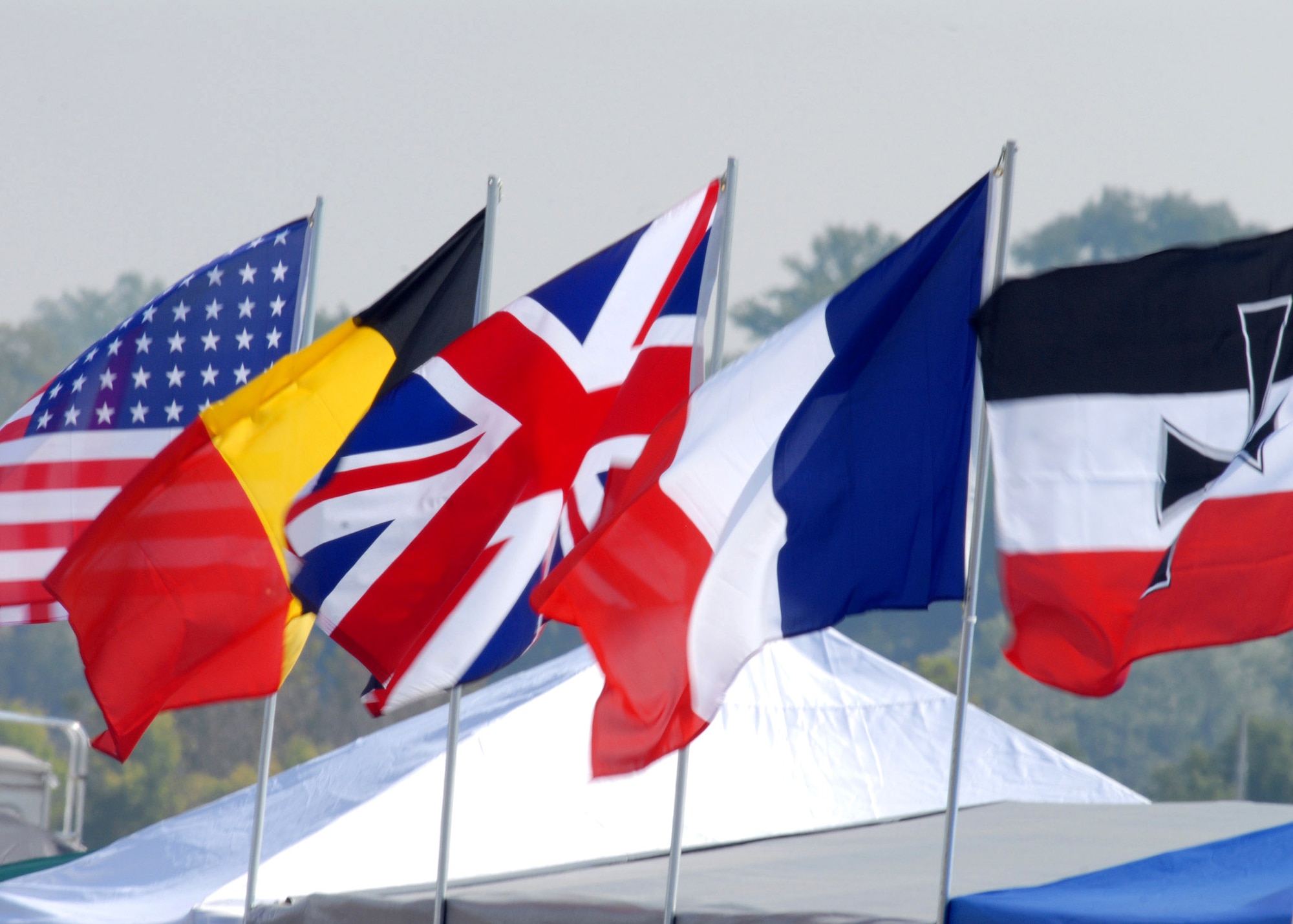 Flags from multiple nationalities are displayed at the Dawn Patrol Rendezvous World War I Fly-In on the grounds of the National Museum of the United States Air Force here on 22 Sept. Activities included period re-enactors in a war encampment setting, era automobiles on display and participating in a parade, flying exhibitions by WWI radio-controlled aircraft, and a collector's show for WWI items.  (U.S. Air Force photo/Staff Sgt Joshua Strang)