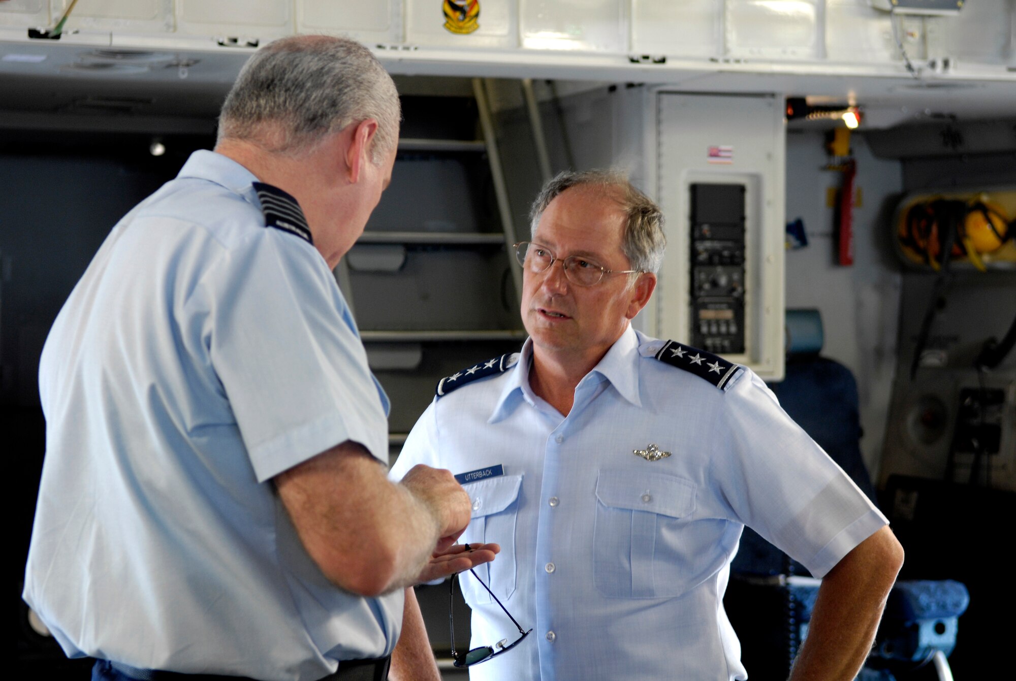 Lt. Gen. Loyd S. "Chip" Utterback talks with Group Captain Peter Norford about the C-17 Globemaster III capabilities Sept. 20 at Hickam Air Force Base, Hawaii, during the Pacific Rim Airpower Symposium. The PACRIM Symposium provides an ideal forum to communicate the value of U.S. engagement with nations of the Asia-Pacific region and our commitment to the internal, local, national and regional audiences. General Utterback is the 13th Air Force commander and Group Captain Norford is the Royal Australian Air Force Aviation and Air Force Safety director of defense. (U.S. Air Force photo/Tech. Sgt. Shane A. Cuomo) 