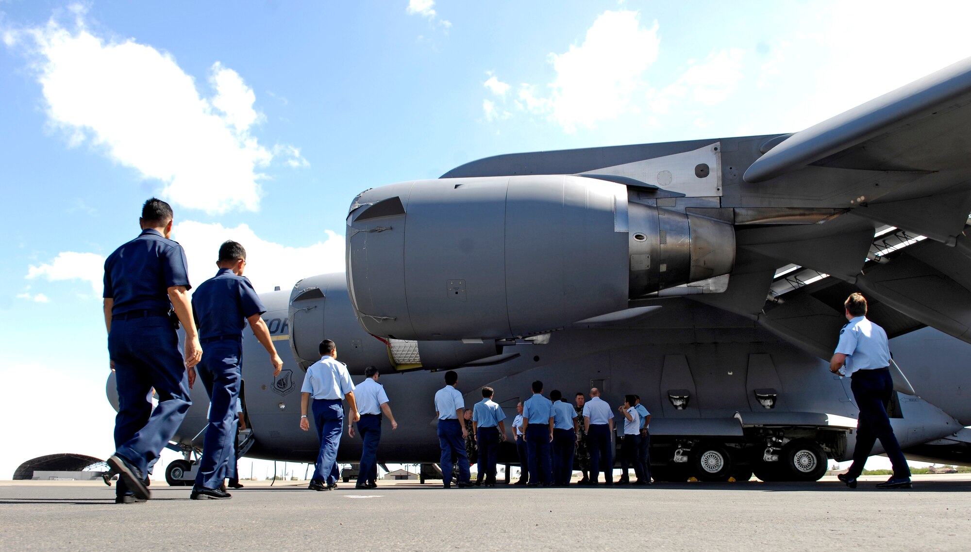 Members of the Pacific Rim Airpower Symposium take a tour of a C-17 Globemaster III, Sept. 20, at Hickam Air Force Base, Hawaii. The 13th Air Force hosted the 17-nation conference focusing on aviation safety and mishap prevention. (U.S. Air Force photo/Tech. Sgt. Shane A. Cuomo) 