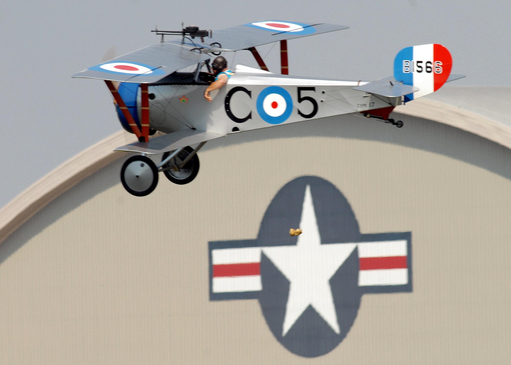 A pilot drops his "flour bomb" during a target competition Sept. 22 at the Dawn Patrol Rendezvous World War I Fly-In on the grounds of the National Museum of the United States Air Force in Dayton, Ohio. Activities included period re-enactors in a war encampment setting, era automobiles on display and participating in a parade, flying exhibitions by WWI radio-controlled aircraft, and a collector's show for WWI items.  (U.S. Air Force photo/Staff Sgt Joshua Strang)