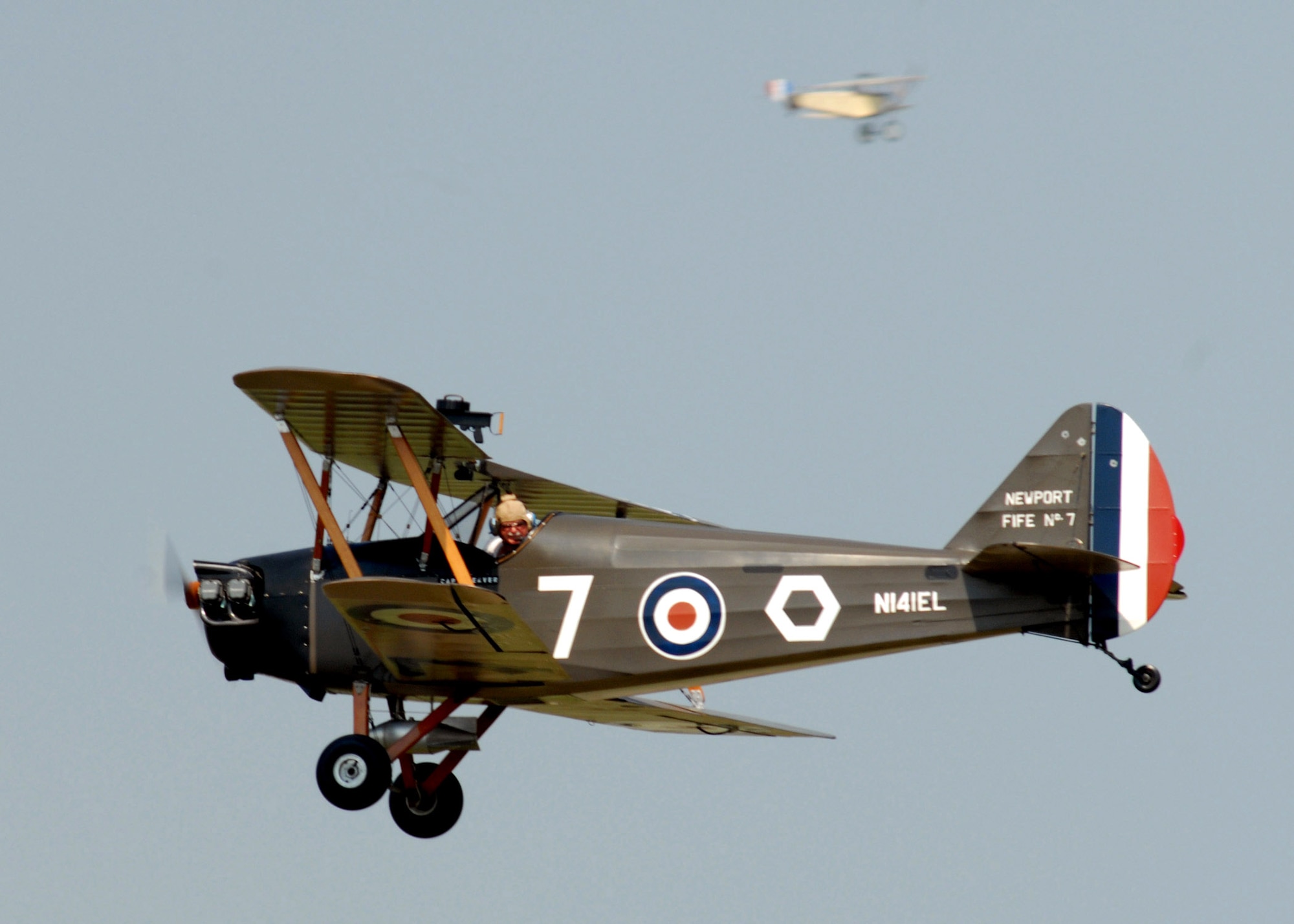 A pilot checks his bomb placement after dropping a "flour bomb" during a target competition Sept. 22 at the Dawn Patrol Rendezvous World War I Fly-In on the grounds of the National Museum of the United States Air Force in Dayton, Ohio. Activities included period re-enactors in a war encampment setting, era automobiles on display and participating in a parade, flying exhibitions by WWI radio-controlled aircraft, and a collector's show for WWI items.  (U.S. Air Force photo/Staff Sgt Joshua Strang)
