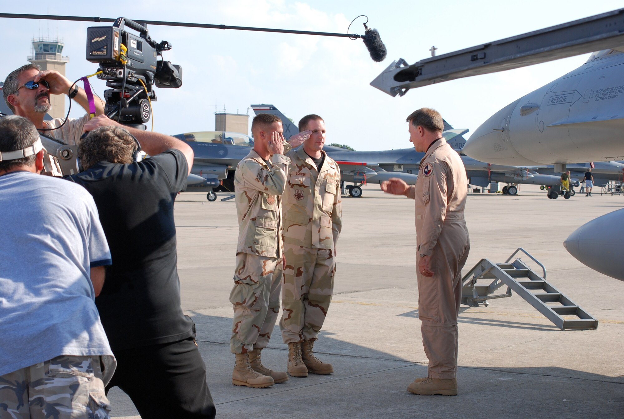 Lt. Gen. John Bradley, Air Force Reserve Command commander, participates in creating the latest commercial for Air Force Reserve recruiting. General Bradley appears here with (l to r) Senior Airmen Travis Sykes and Jacob Schwen, both from the 301st Aircraft Maintenance Squadron at Naval Air Station Joint Reserve Base Fort Worth, Texas on Sept. 13. The commercial will begin airing later this year.