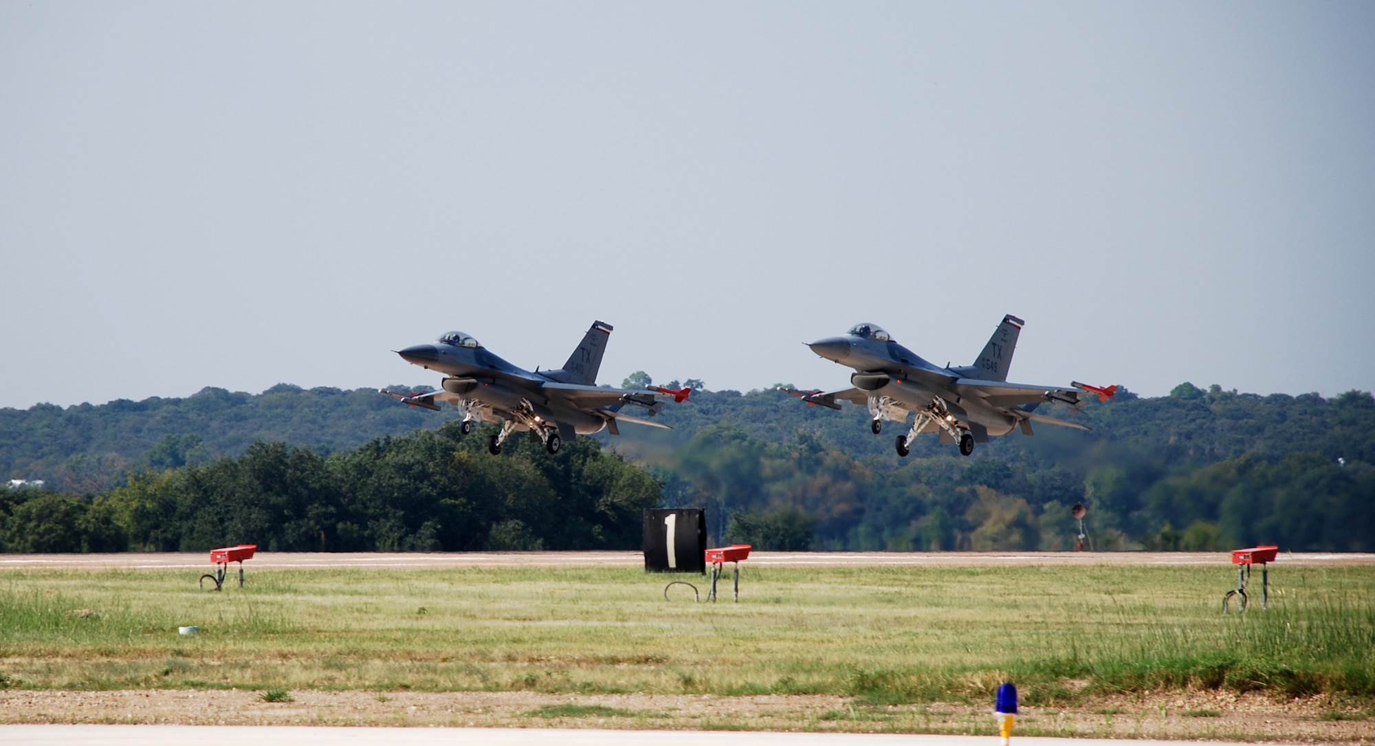 Lt. Gen. John A. Bradley, Chief of Air Force Reserve and Air Force Reserve Command commander, takes off as wingman with Maj. Lane Beene, 457th Fighter Squadron pilot, as the lead in a training mission that took the general into 7000 flying hours. Flight hours can mark a pilot's career experience; however, General Bradley's total military flying time is nearly twice that of the average career fighter pilot. He will continue to fly the F-16 Fighting Falcon out of Naval Air Station Joint Reserve Base Fort Worth, Texas, until his retirement next summer.