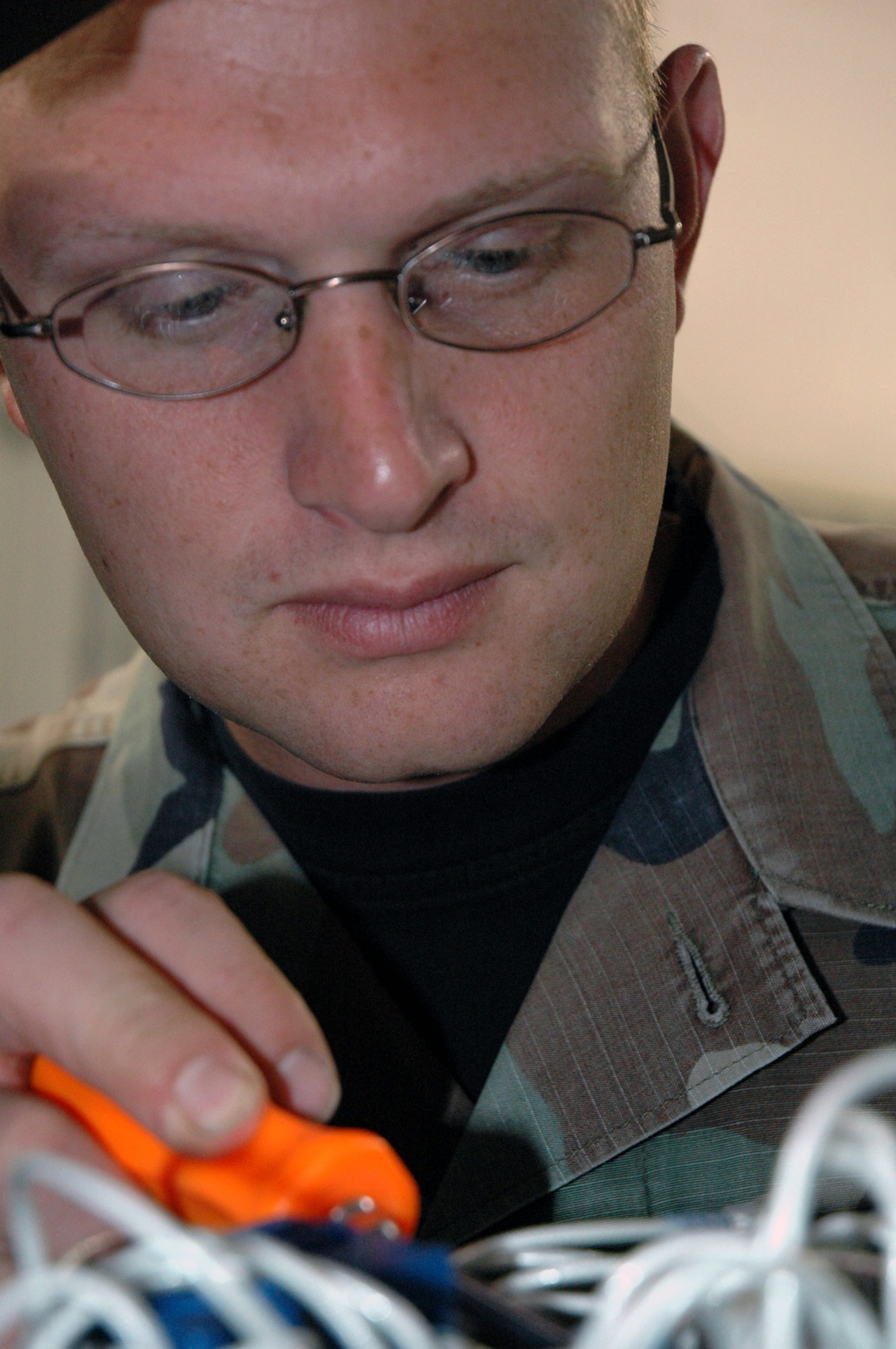 Staff Sgt. Jonathon McClure, course director for the Mobility Operations School Mobile Command and Control Environmental Control Unit Course and an instructor for the Mobile C-2 Generator Course, works on a generator in his training facility preparing it for the next course Sept. 25, 2007, at the U.S. Air Force Expeditionary Center on Fort Dix, N.J.  Sergeant McClure's instruction for mobile command and control Airmen prepare them for ground operations in a deployed environment.  (U.S. Air Force Photo/Tech. Sgt. Scott T. Sturkol)