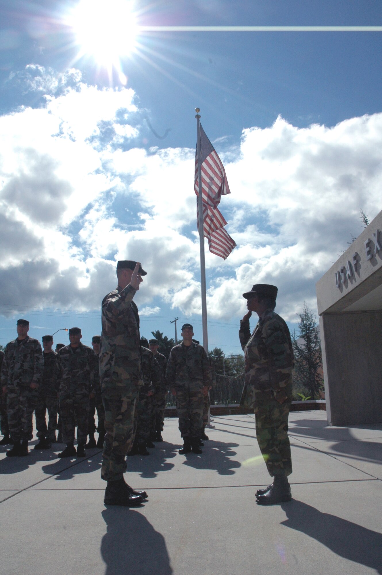 Capt. Robert G. Prausa, 421st Combat Training Squadron, Fort Dix, N.J., holds a reenlistment ceremony for Tech. Sgt. Vivian Bender, also from the 421st, in front of the U.S. Air Force Expeditionary Center Sept. 18, 2007.  Sergeant Bender elected to have her reenlistment on the same day as the Air Force's 60th anniversary.  (U.S. Air Force Photo/Tech. Sgt. Scott T. Sturkol)