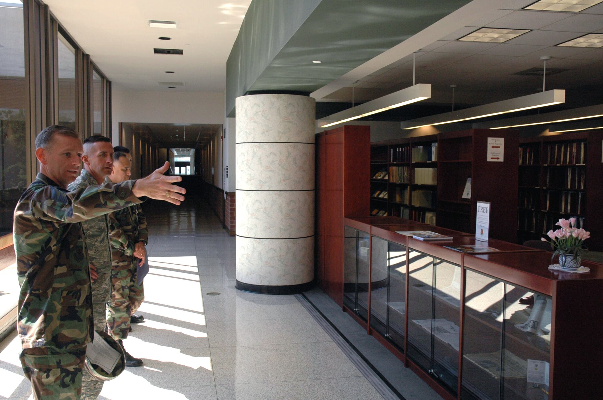 Chief Master Sgt. Jeffry Helm, U.S. Air Force Expeditionary Center command chief master sergeant, shows the Gen. Ronald R. Fogleman Library to Chief Master Sgt. Joseph Barron Jr., Air Mobility Command's command chief master sergeant, during a visit by Chief Barron to the Center Sept. 18, 2007.  (U.S. Air Force Photo/Tech. Sgt. Scott T. Sturkol)