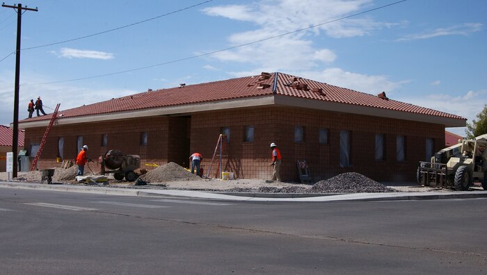 A contracted construction crew nears completion of the new Bio-Environmental facility here, Sept. 21. The project is one element of more than 50 projects currently underway as part of an ongoing construction effort to address Nellis’ mission, quality of life and environmental needs. (U.S. Air Force photo by Staff Sgt. Jacob R. McCarthy)