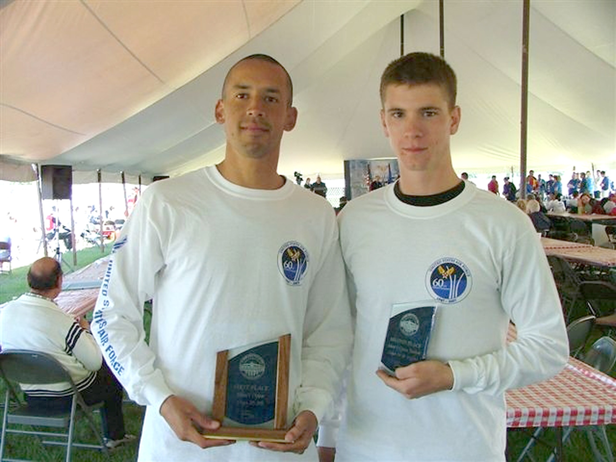 Ivan Alvarado and Tyler Breske hold the awards they won after competing in the half-marathon at the 11th Annual United States Air Force Marathon, which took place Sept. 14 - 15 at Wright-Patterson Air Force Base, Ohio.

The two airmen first class were part of a 10-man team from the 311th Training Squadron, which competed at the marathon. The 311 TRS is a geographically separated unit of the 17th Training Wing, and is located at the Presidio of Monterey, Calif.

Alvarado missed finishing first by four seconds. However, his time of 1 hour and 12 minutes allowed him finish first in his age bracket, 25-29 years old, second overall for the half-marathon. Breske was not far behind Alvardo. He came in second in his age bracket, 19 years old and under, with a time of 1 hour and 29 minutes in the half marathon. 

“It was a big accomplishment for our team to have these Airmen come back to the squadron with such a great achievement,” said Staff Sgt. Henry Serrano III, team Manager.  (U.S. Air Force photo by Staff Sgt. Henry Serrano III)