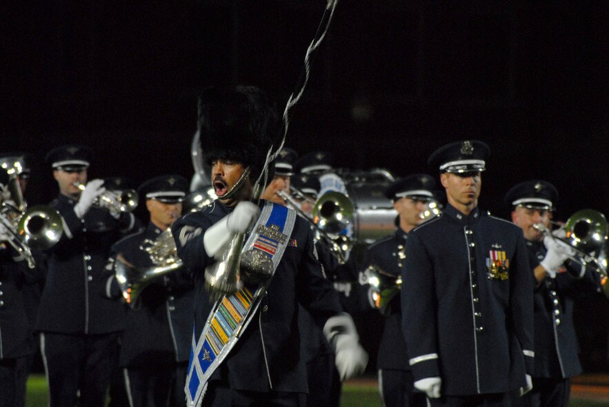 BOLLING AFB, D.C. -- Chief Master Sgt. Edward J. Teleky, Air Force Band drum major, leads the band's ceremonial brass during their performance at the 60th Anniversary Air Force Tattoo dress rehearsal Sept. 22.
The military tattoo, which is held annually at Bolling, highlights troop excellence and readiness.  The tattoo dates back to the mid-17th century British Army deployment to the Netherlands in which drummers were sent from the garrison to the towns at 9:30 each night to let soldiers know it was time to return to the fort.
(U.S. Air Force photo by Staff Sgt. Madelyn Waychoff)