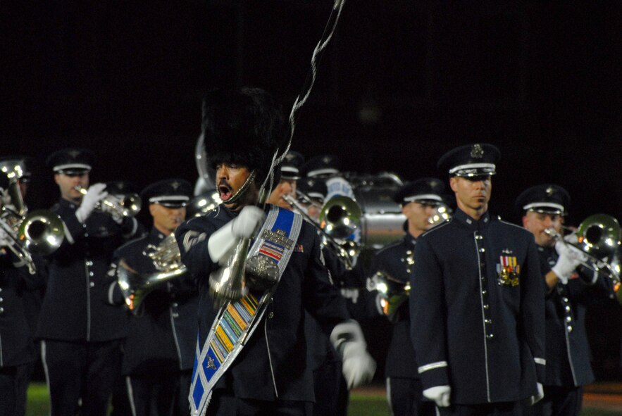 BOLLING AFB, D.C. -- Chief Master Sgt. Edward J. Teleky, Air Force Band drum major, leads the band's ceremonial brass during their performance at the 60th Anniversary Air Force Tattoo dress rehearsal Sept. 22.
The military tattoo, which is held annually at Bolling, highlights troop excellence and readiness.  The tattoo dates back to the mid-17th century British Army deployment to the Netherlands in which drummers were sent from the garrison to the towns at 9:30 each night to let soldiers know it was time to return to the fort.
(U.S. Air Force photo by Staff Sgt. Madelyn Waychoff)