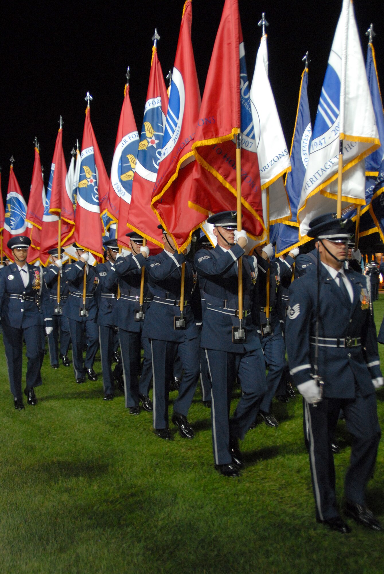 BOLLING AFB, D.C. -- Airmen from the Air Force Honor Guard present the Air Force 60th Anniversary Flag at the 60th Anniversary Air Force Tattoo dress rehearsal Sept. 22.
The military tattoo, which is held annually at Bolling, highlights troop excellence and readiness.  The tattoo dates back to the mid-17th century British Army deployment to the Netherlands in which drummers were sent from the garrison to the towns at 9:30 each night to let soldiers know it was time to return to the fort.
(U.S. Air Force photo by Staff Sgt. Madelyn Waychoff)