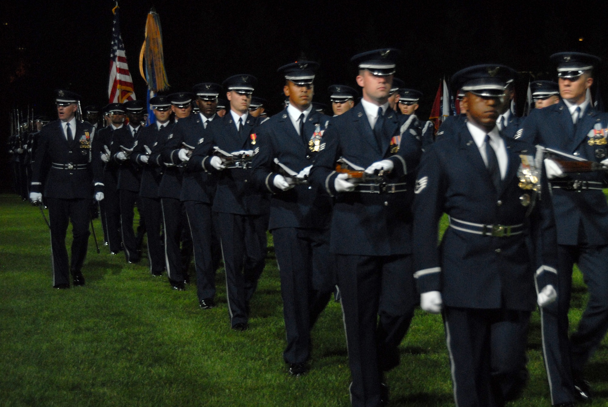 BOLLING AFB, D.C. -- Airmen from the Air Force Honor Guard perform a pass in review during the 60th Anniversary Air Force Tattoo dress rehearsal Sept. 22.
The military tattoo, which is held annually at Bolling, highlights troop excellence and readiness.  The tattoo dates back to the mid-17th century British Army deployment to the Netherlands in which drummers were sent from the garrison to the towns at 9:30 each night to let soldiers know it was time to return to the fort.
(U.S. Air Force photo by Staff Sgt. Madelyn Waychoff)