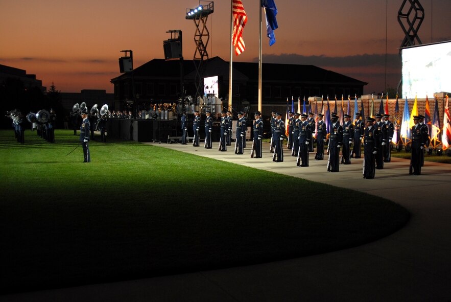BOLLING AFB, D.C. -- Airmen from the Air Force Honor Guard stand ready in formation before performing marching orders and rifle manuals at the 60th Anniversary Air Force Tattoo dress rehearsal Sept. 22.
The military tattoo, which is held annually at Bolling, highlights troop excellence and readiness.  The tattoo dates back to the mid-17th century British Army deployment to the Netherlands in which drummers were sent from the garrison to the towns at 9:30 each night to let soldiers know it was time to return to the fort.
(U.S. Air Force photo by Staff Sgt. Madelyn Waychoff)