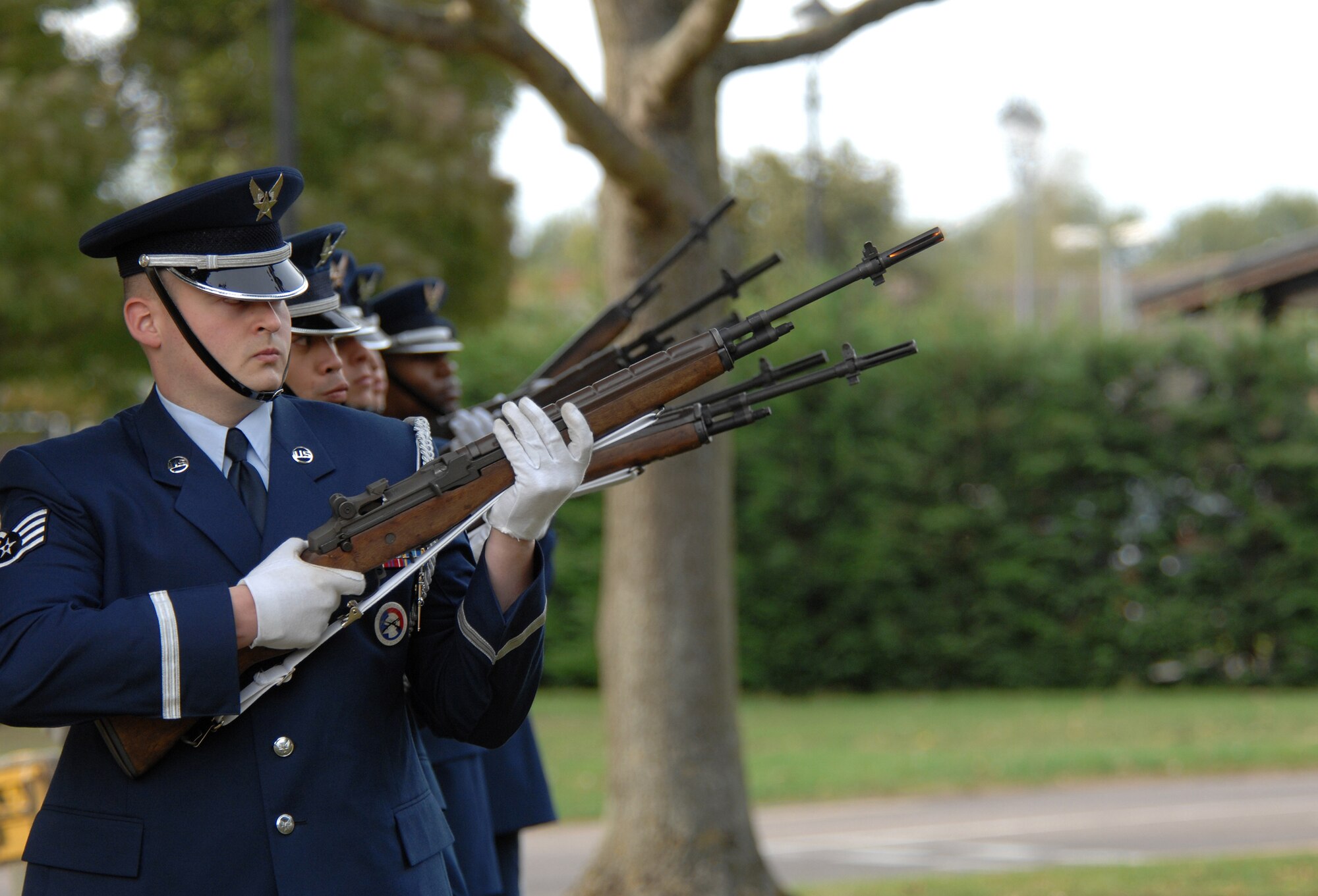 Staff Sgt. Shaun Eby, an Airman from the 100th Logistics Readiness Squadron and RAF Mildenhall Honor Guard, performs a 21 gun salute along with six other honor guard members as part of a Retreat ceremony during the annual Prisoner of War/Missing in Action week of remembrance, Sept. 21, 2007. (U.S. Air Force photo by Tech. Sgt. Tracy L. DeMarco)
