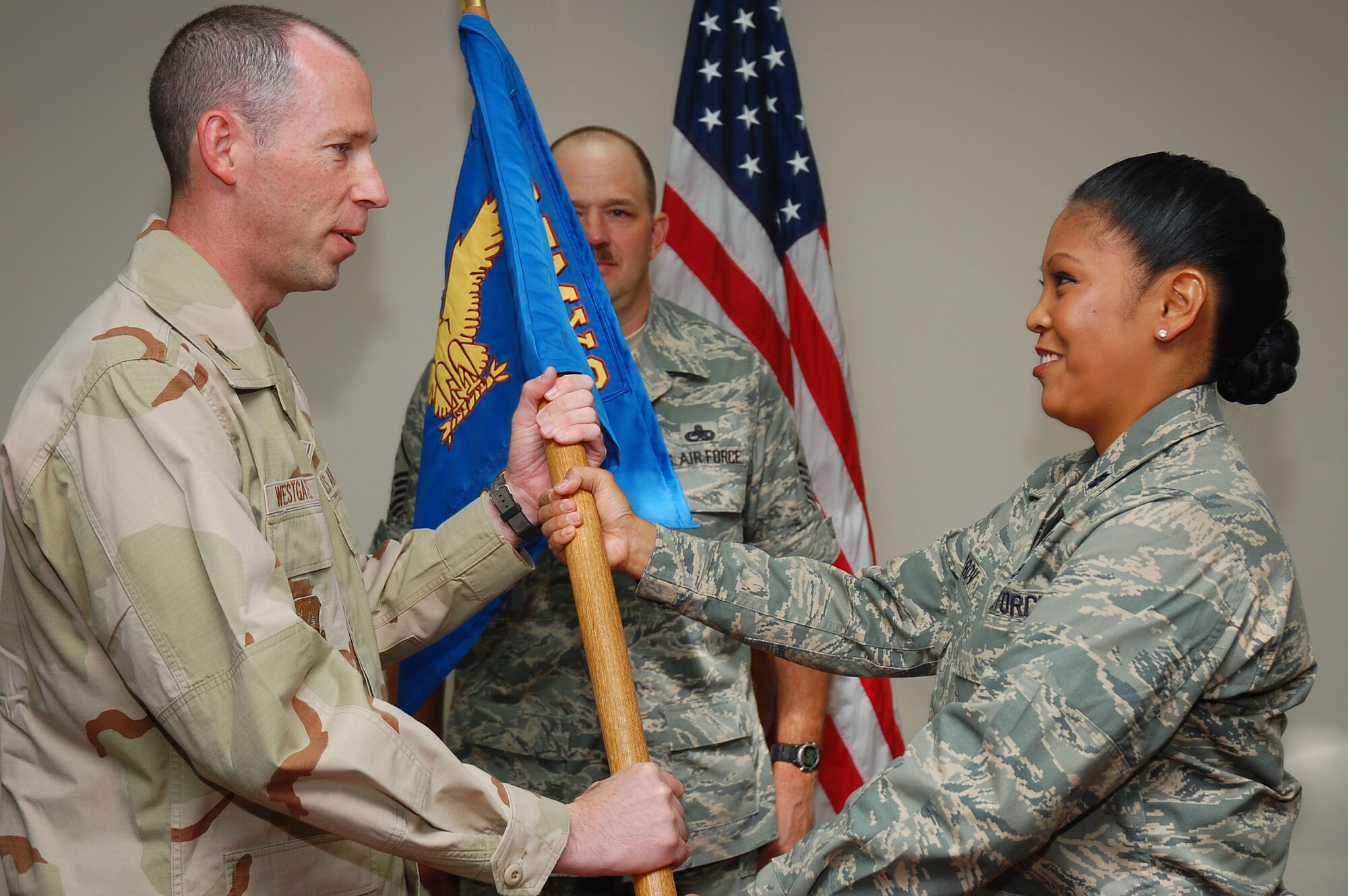 SOUTHWEST ASIA -- 386th Expeditionary Aircraft Maintenance Squadron change of command.  Lt. Col. Shirlene Ostrov assumed command of the squadron from Lt. Col. Ricky Thompson here Sept. 24.  (U.S. Air Force photo by Staff Sgt. Tia Schroeder)