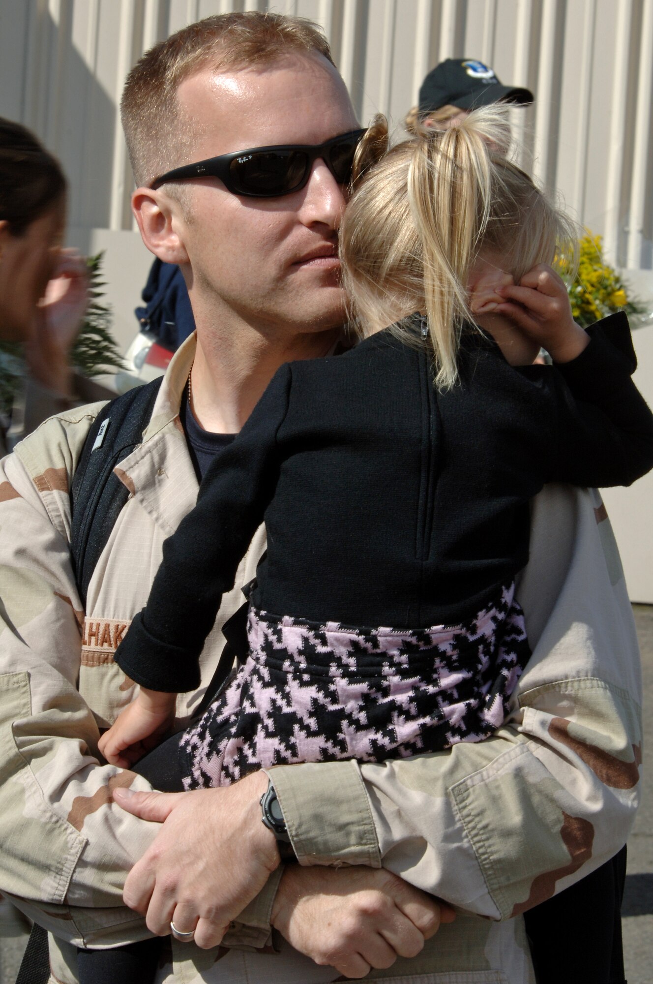Capt James Winkelhake, 603rd Air Operations Center, hugs his daughter Katlyn on Ramstein Air Base, Germany, Sept. 19. Capt. Winkelhake returned to his family safely from a six month deployment to Southwest Asia. (U.S. Air Force photo/Airman 1st Class Marc I. Lane)