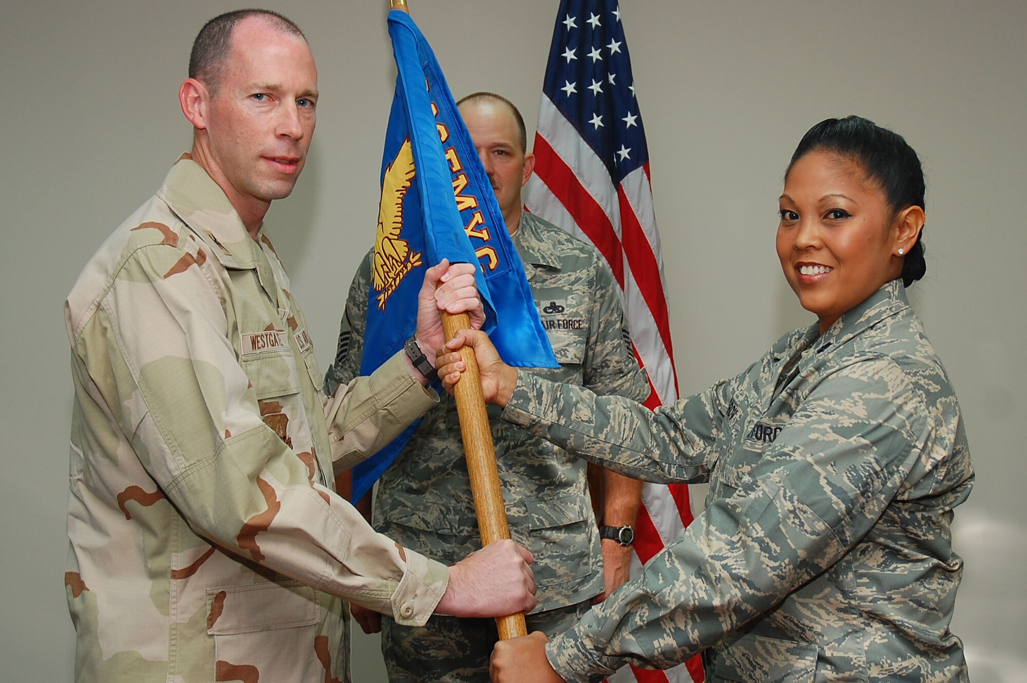 SOUTHWEST ASIA -- 386th Expeditionary Aircraft Maintenance Squadron change of command.  Lt. Col. Shirlene Ostrov assumed command of the squadron from Lt. Col. Ricky Thompson here Sept. 24.  (U.S. Air Force photo by Staff Sgt. Tia Schroeder)