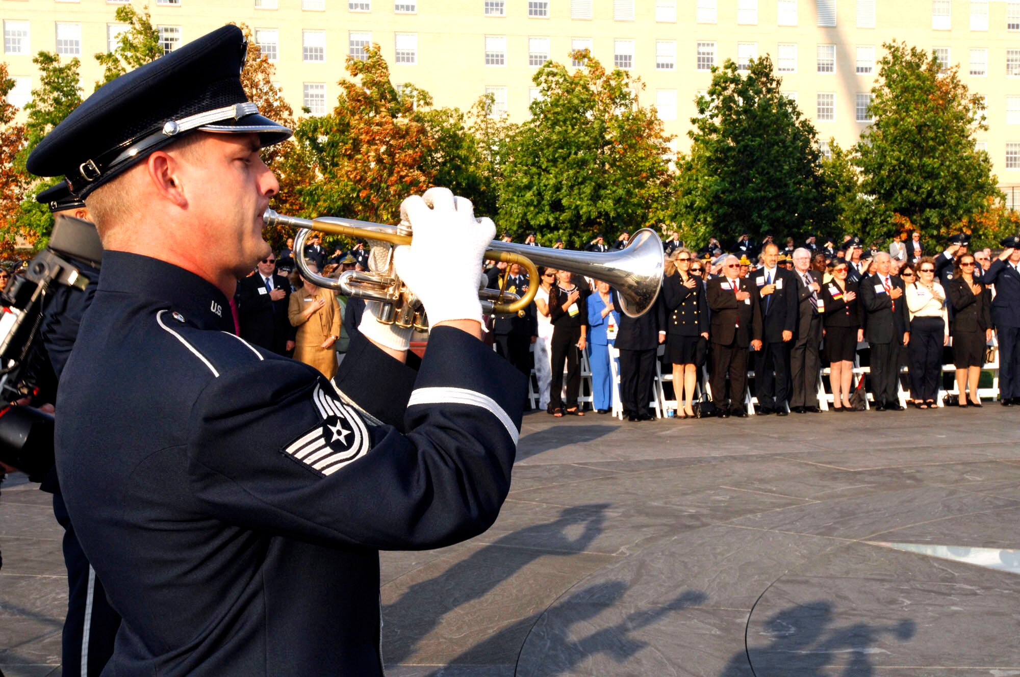 Tech. Sgt. Chris Wilson plays "Taps" during a wreath-laying ceremony sponsored by the Air Force Association at the Air Force Memorial Sept. 23 in Arlington, Va. The ceremony was observed in conjunction with the Global Air Chiefs Conference Sept. 24 to 26, hosted by Air Force Chief of Staff Gen. T. Michael Moseley. More than 80 air chiefs from around the globe are attending the conference. (U.S. Air Force photo/Mike Paussic)