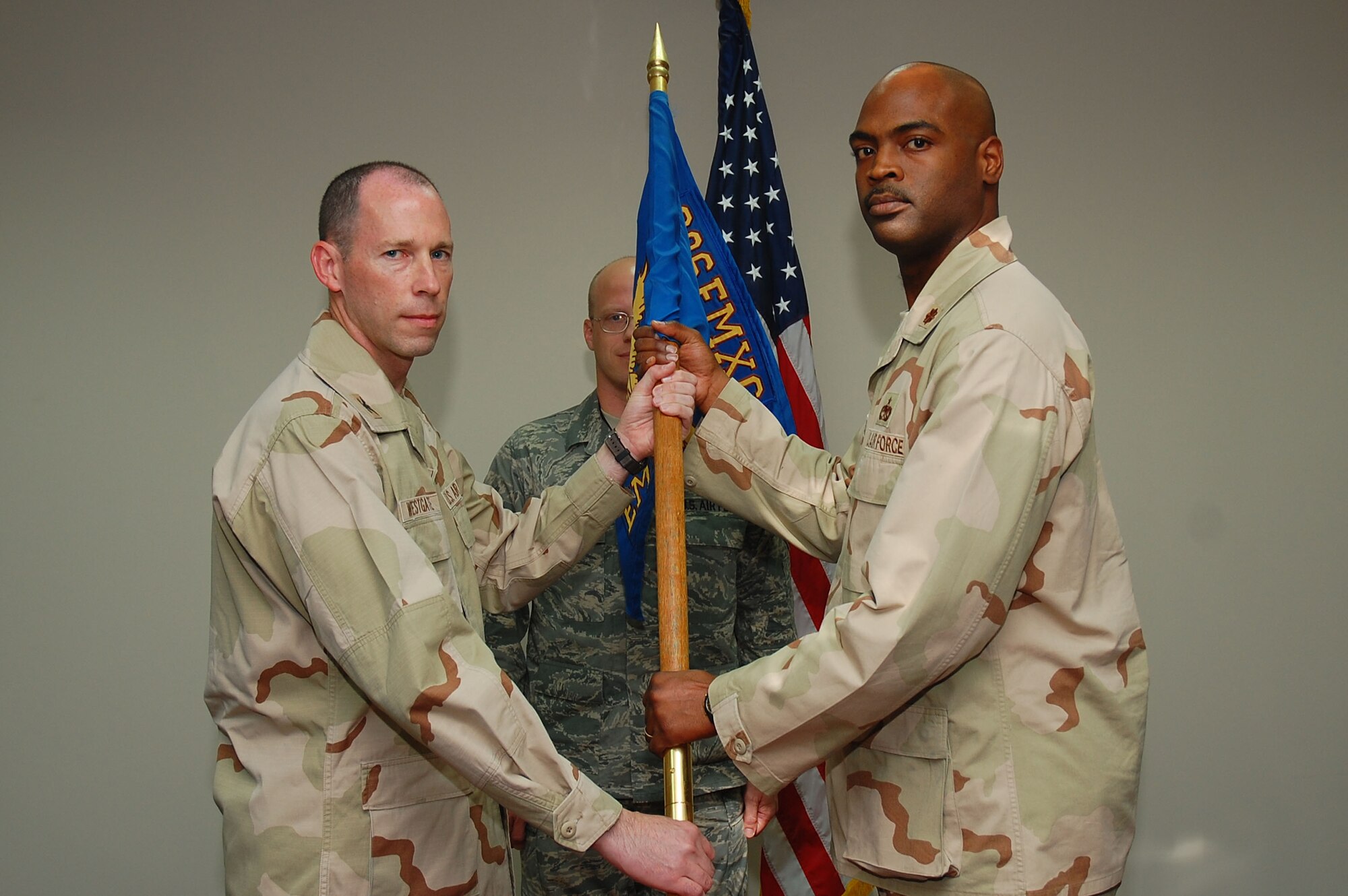SOUTHWEST ASIA -- 386th Expeditionary Maintenance Squadron change of command.  Maj. Emille Bryant assumed command of the squadron from Maj. Konrad Cote here Sept. 24.  (U.S. Air Force photo by Staff Sgt. Tia Schroeder)