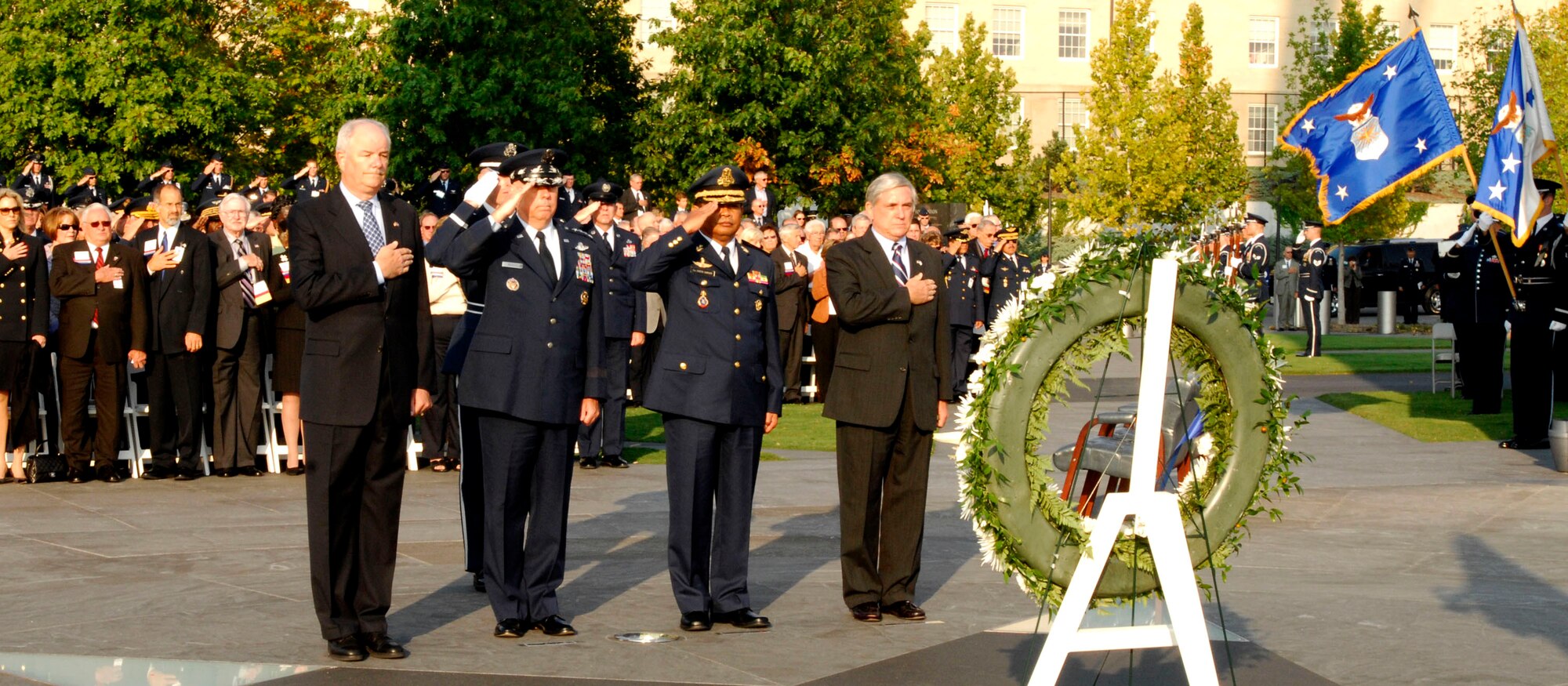 Secretary of the Air Force Michael W. Wynne (from left), Air Force Chief of Staff Gen. T. Michael Moseley, Cambodian Air Chief Lt. Gen. Soeng Samnang, and Air Force Association Chairman of the Board Robert Largent present a wreath on behalf of AFA at a Sept. 23 ceremony at the Air Force Memorial in Arlington, Va. The annual AFA Conference and Technology Exposition and the Air Force chief of staff are hosting the Global Air Chiefs Conference Sept. 24 to 26. More than 80 air chiefs from around the globe are attending the conference. (U.S. Air Force photo/Michael Paussic)
